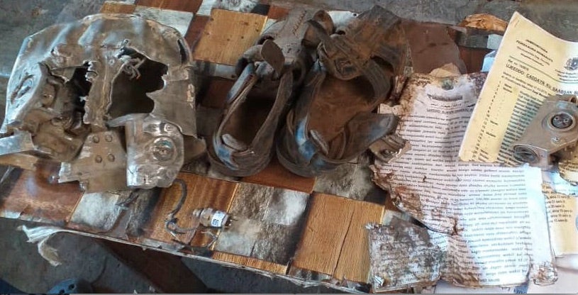 Relatives of the six people known killed in the March 10, 2020 US airstrike on a minibus near the village of Ugunji in Lower Shabelle, Somalia, collected the few objects and possessions they could find during a visit to the site soon after the attack. © 2020 Private  