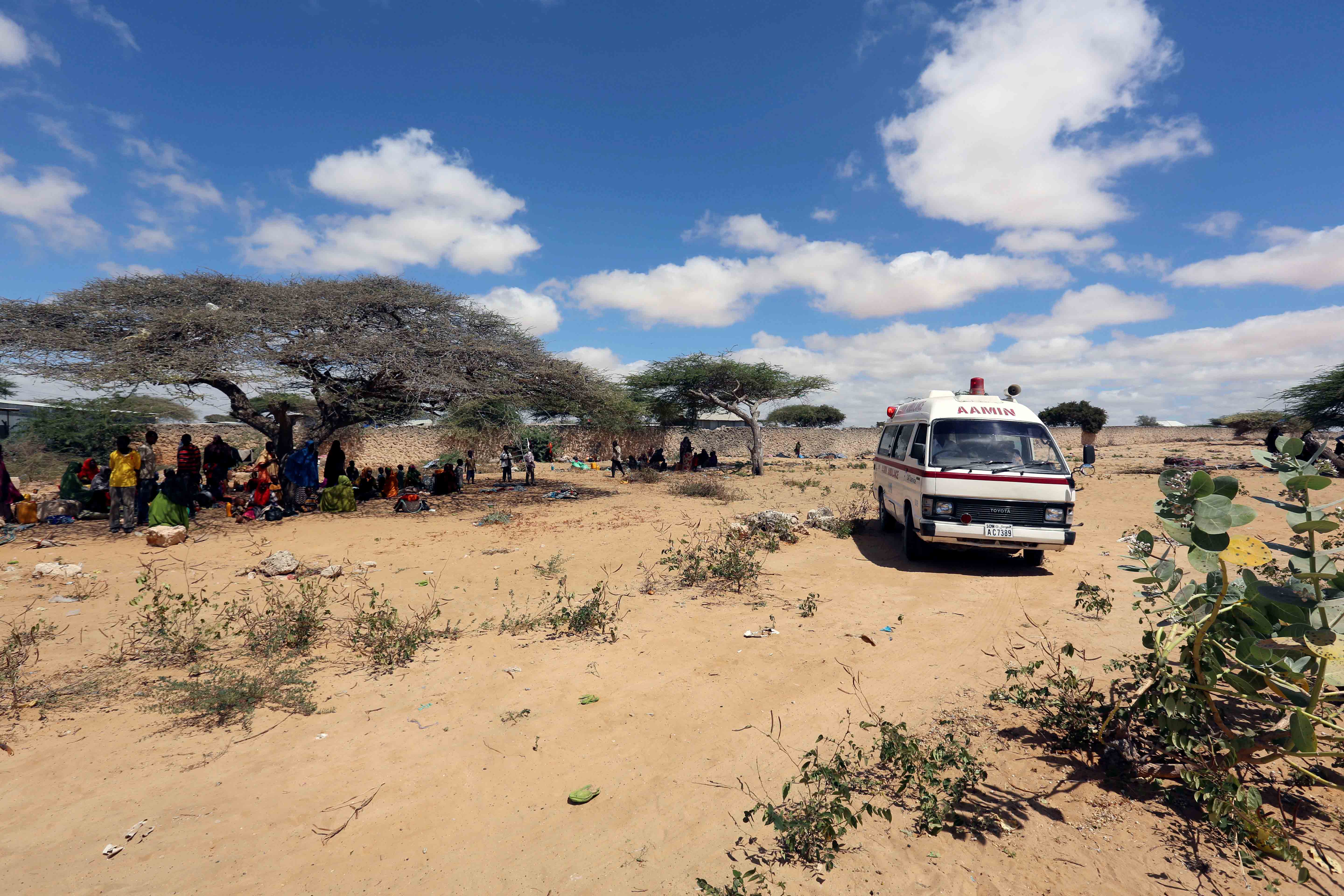 An ambulance transports patients to a  hospital from a camp for the internally displaced people on the outskirts Mogadishu, Somalia, March 2017.