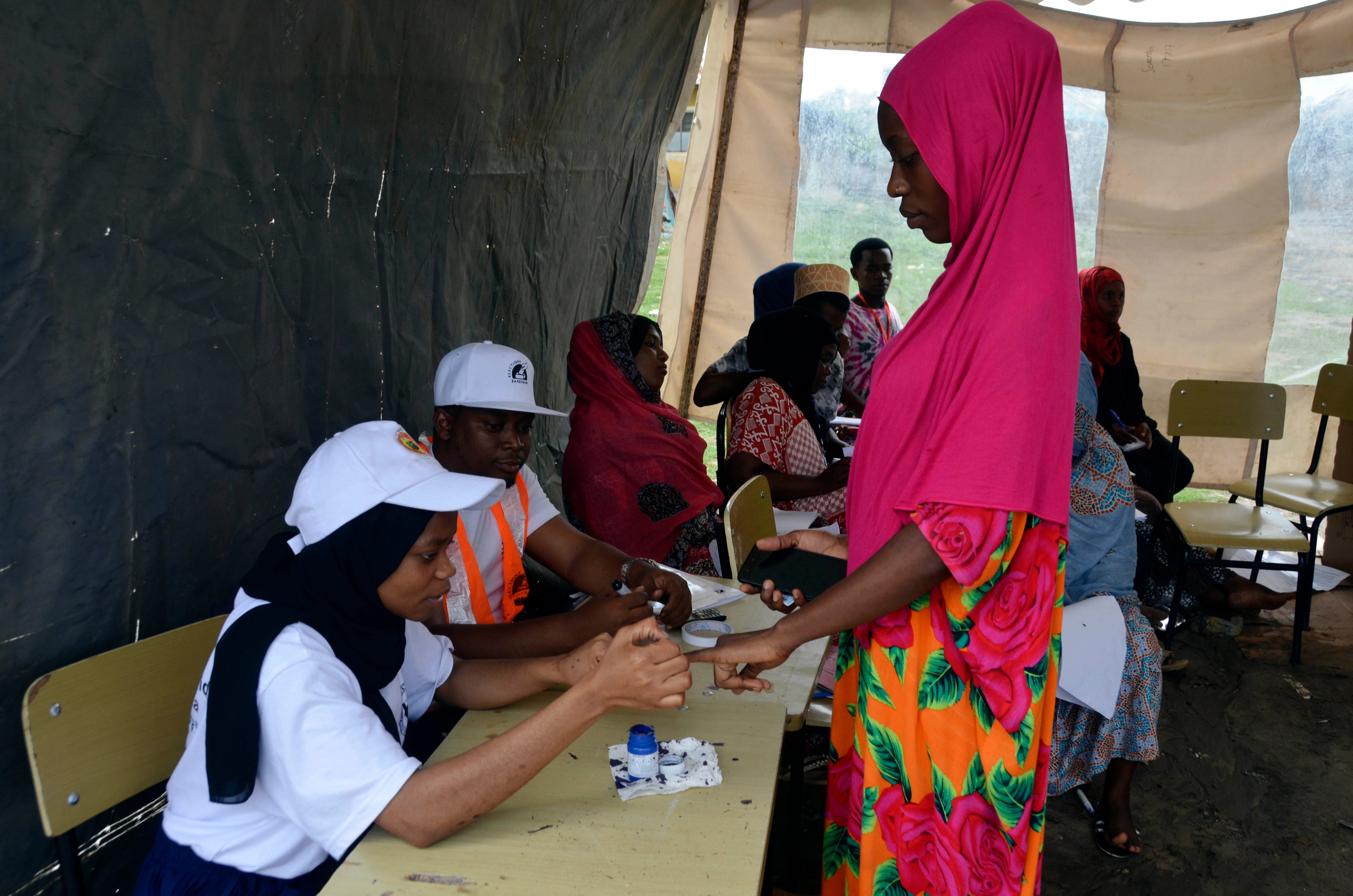 A woman inks her finger after voting in Zanzibar, Tanzania, October 28, 2020.