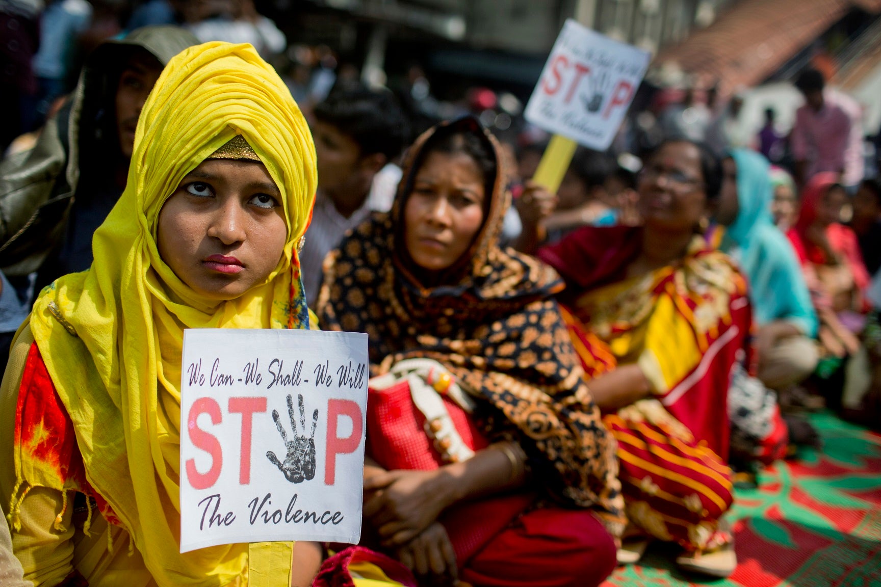 Bangladeshi women hold placards during a rally to mark the International Women's Day in Dhaka, Bangladesh.
