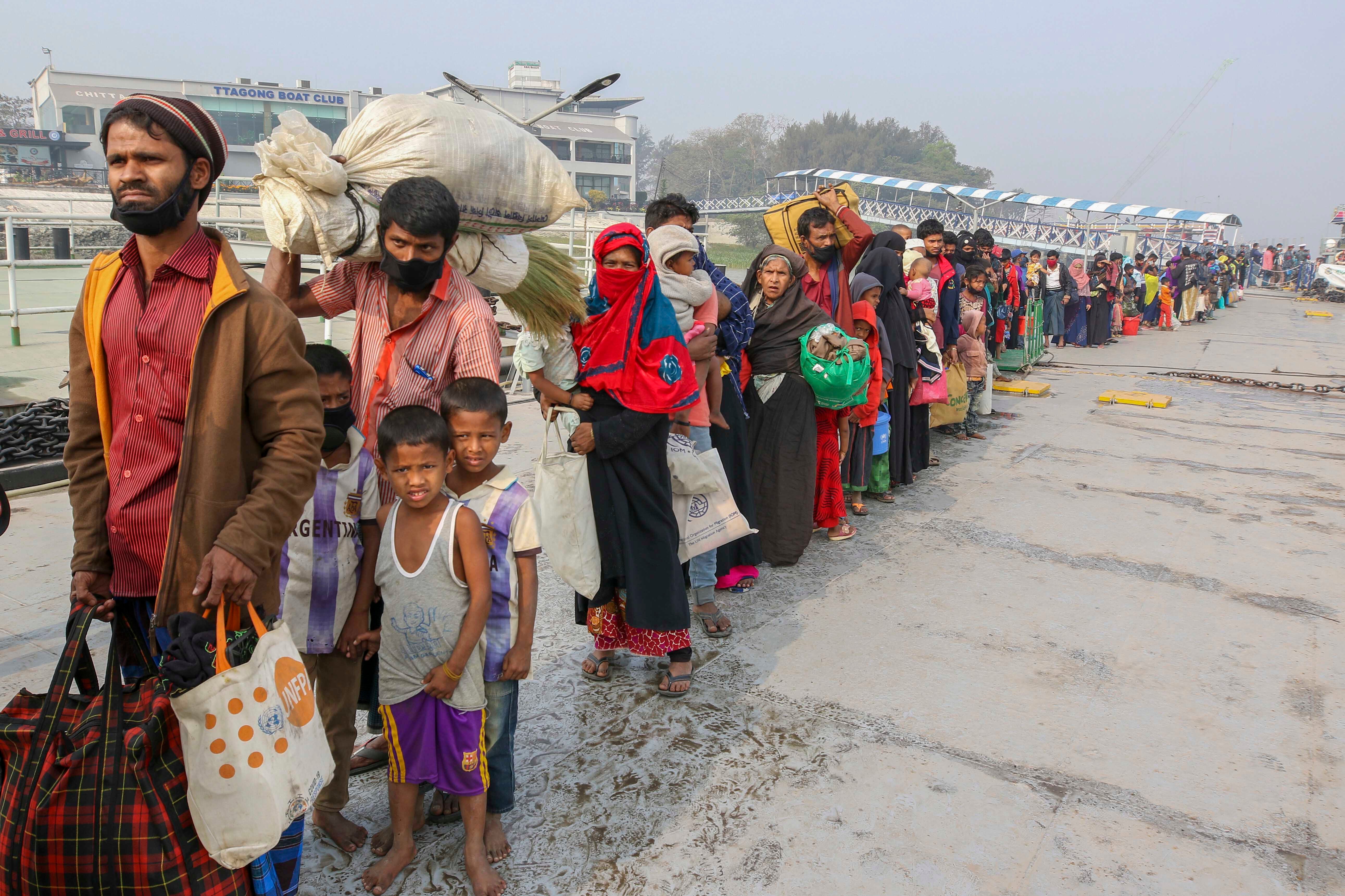 Rohingya refugees headed to the Bhasan Char island prepare to board navy vessels from the south eastern port city of Chattogram, Bangladesh on Feb.15,2021. © 2021 AP Photo 
