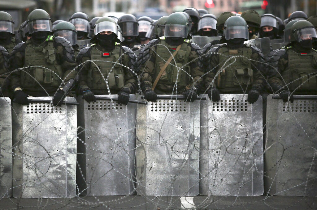 Belarusian police block a street during  opposition rally
