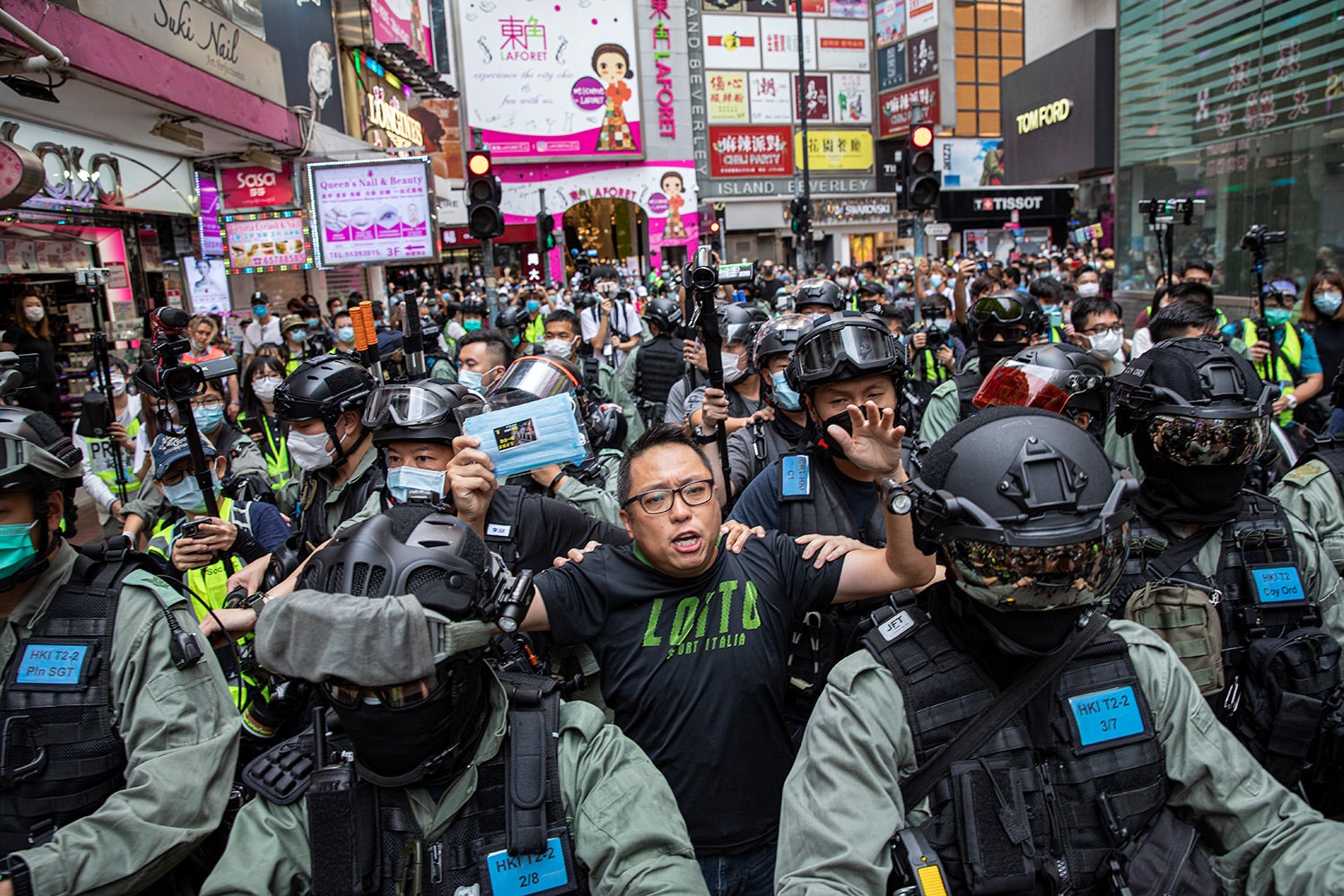 Tam Tak-chi, also known as Fast Beat, is arrested by the police on May 24, 2020, while handing out masks and criticizing the government at a street stall.  