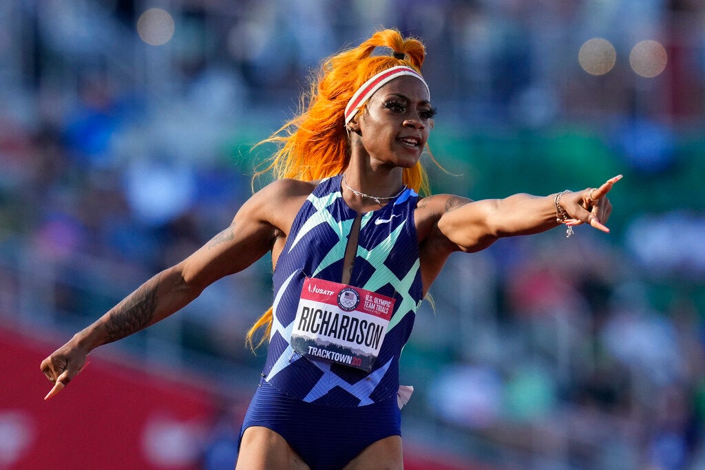Sha'Carri Richardson celebrates after winning the first heat of the semi-finals in women's 100-meter run at the U.S. Olympic Track and Field Trials Saturday, June 19, 2021, in Eugene, Oregon