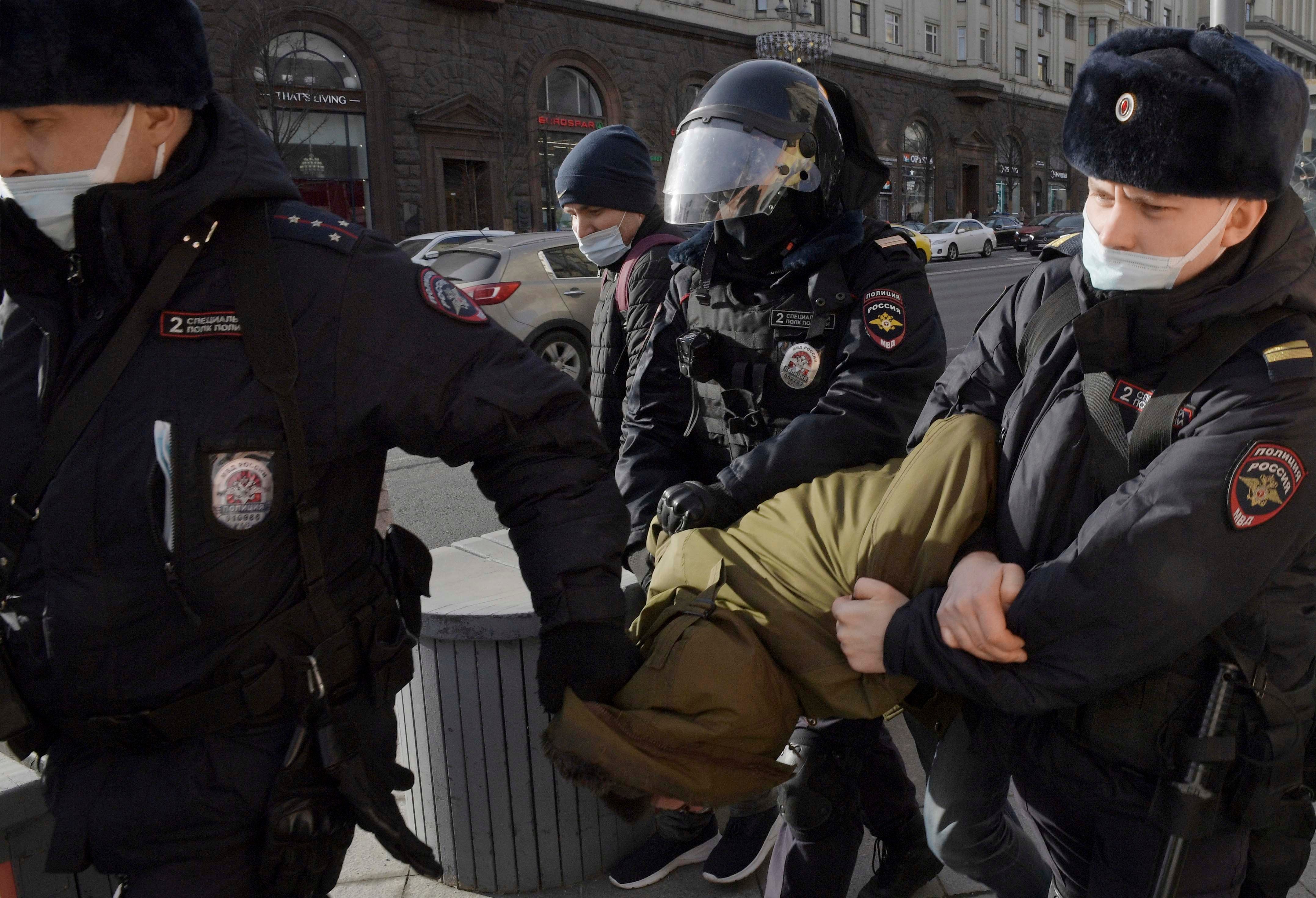 Police officers detain a protester in Manezhnaya Square, Moscow, Russia on March 6, 2022.