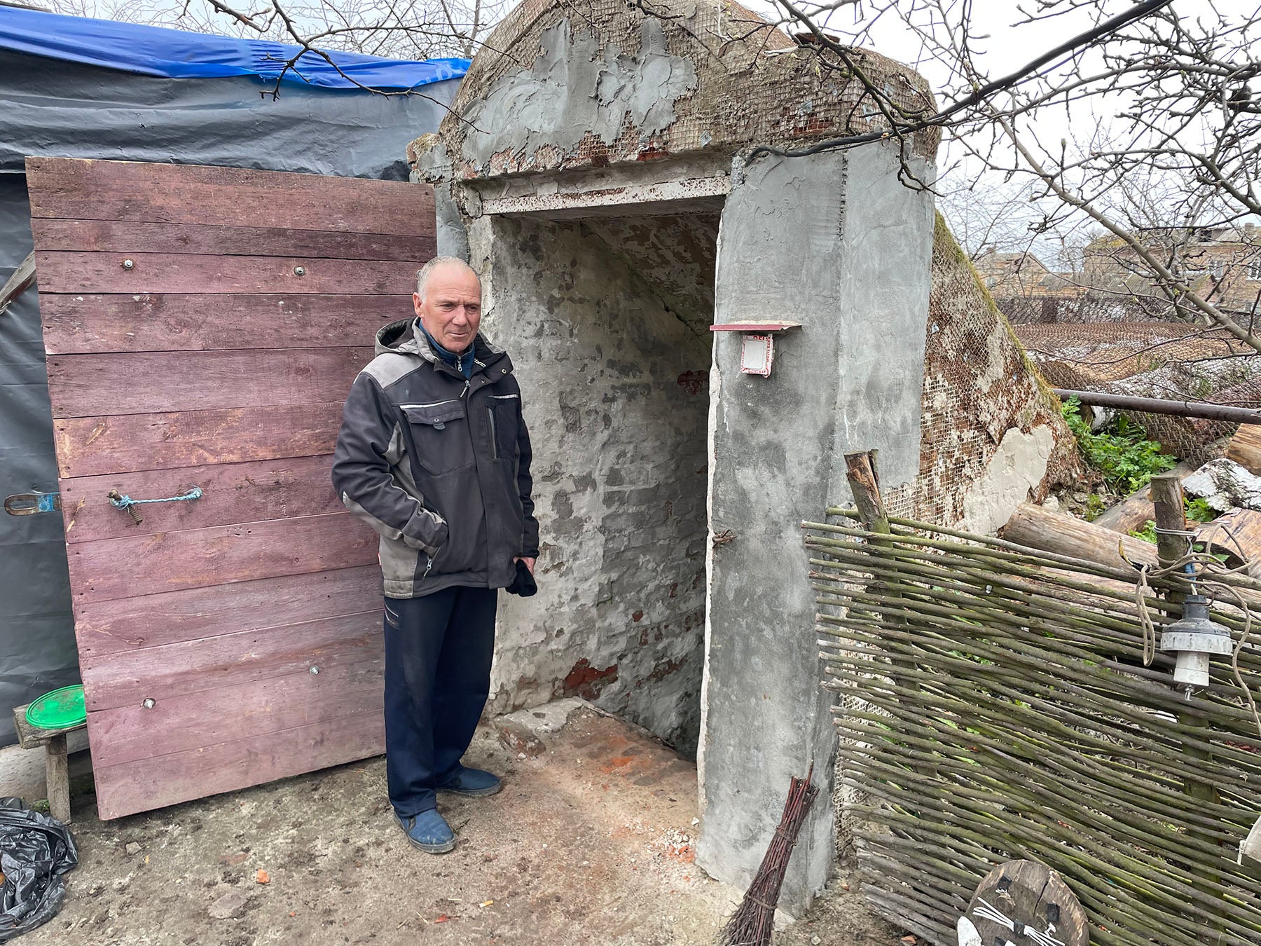 Volodymyr Ivashchenko shows the basement where he sheltered in the initial days of the war, together with his wife, mother-in-law, daughter, and 3-year-old grandson, in Yahidne, April 17, 2022.