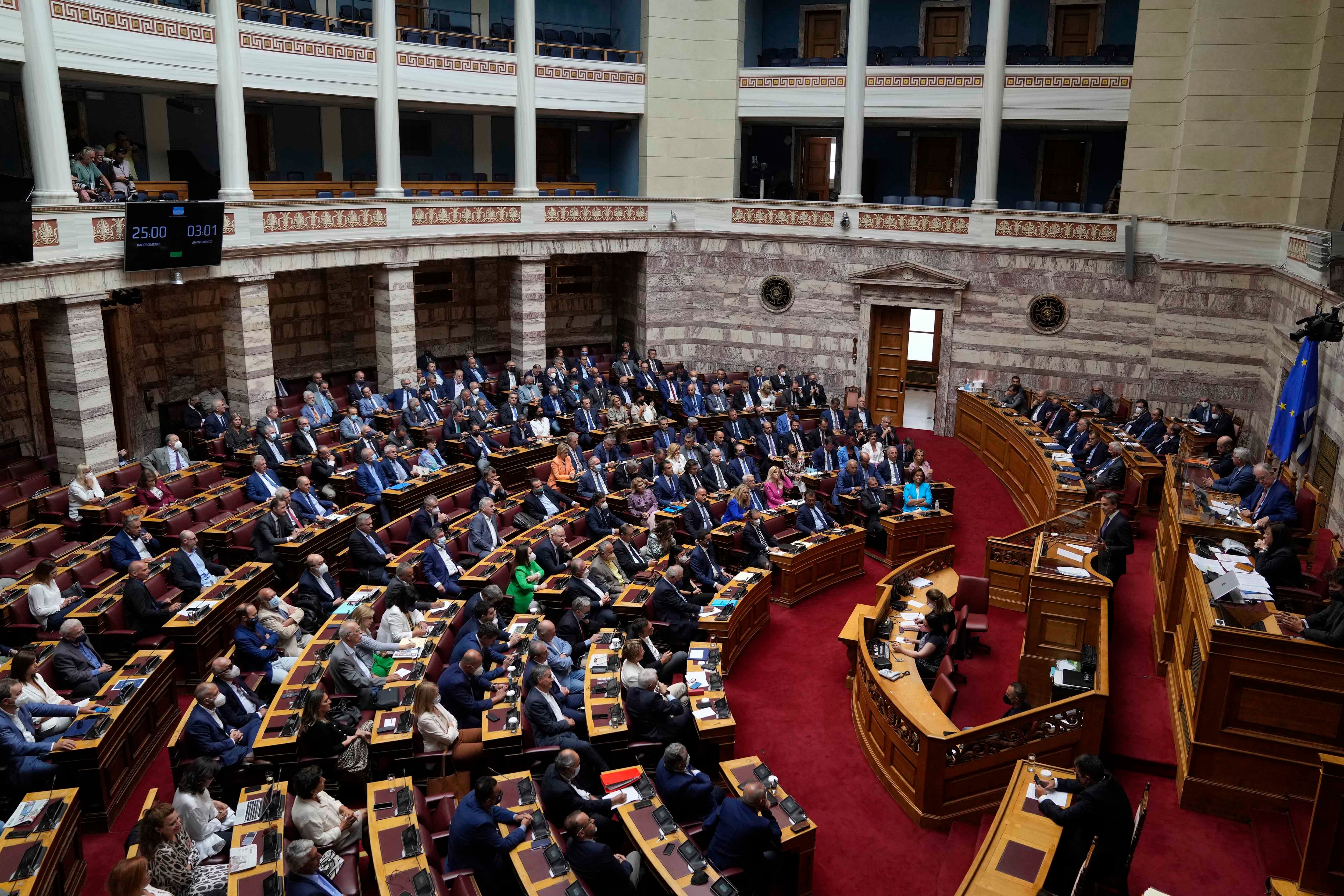 Greece's Prime Minister Kyriakos Mitsotakis speaks during a parliament session in Athens, Greece, Friday, Aug. 26, 2022. 