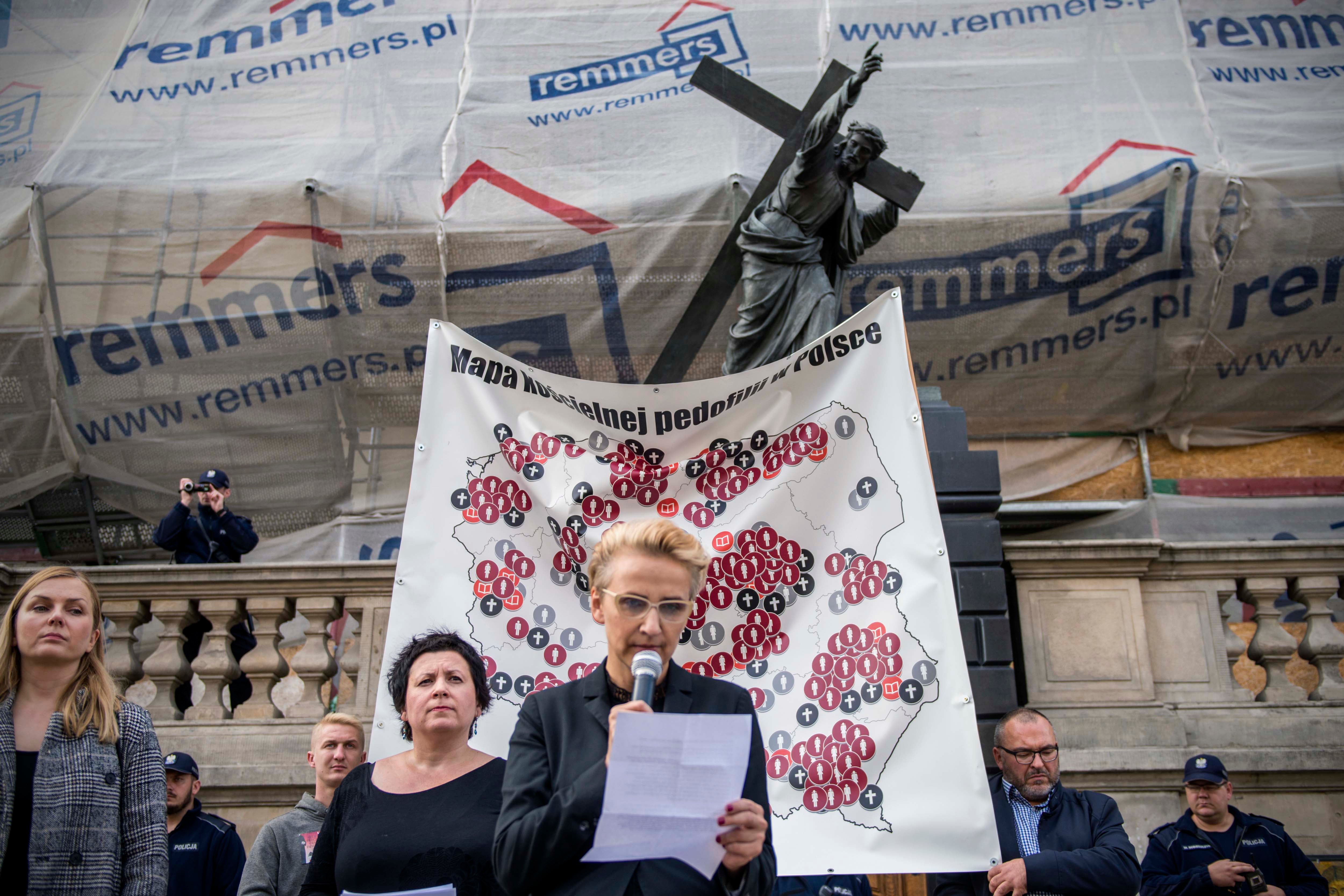 Joanna Scheuring-Wielgus, a social activist and politician, reads testimony from a child who was molested by a priest during a protest in Warsaw, October 7, 2018.