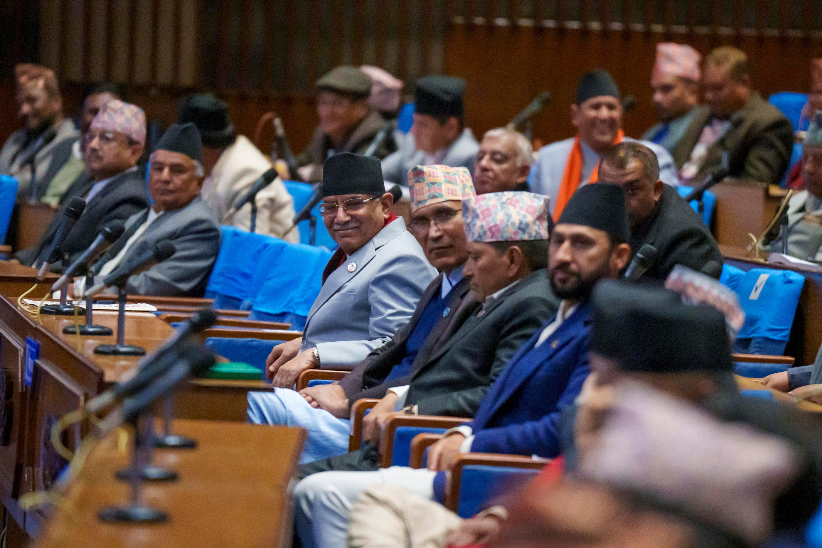 Nepali Prime Minister Pushpa Kamal Dahal, center, sits among other party leaders in parliament in Kathmandu, Nepal.
