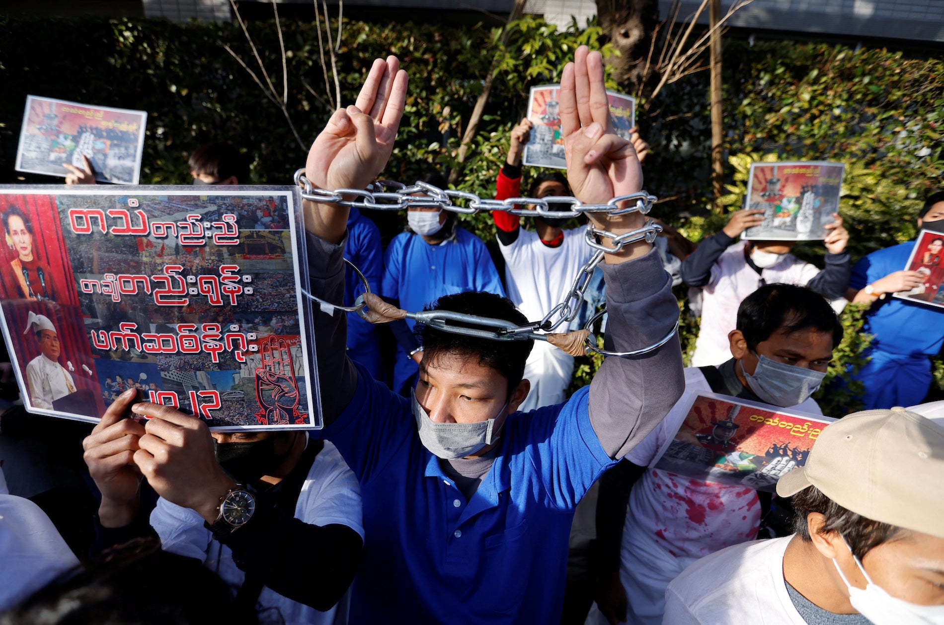 A Myanmar protester raises three-finger salutes during a rally to mark the second anniversary of Myanmar's 2021 military coup, outside Myanmar’s embassy in Tokyo, Japan.