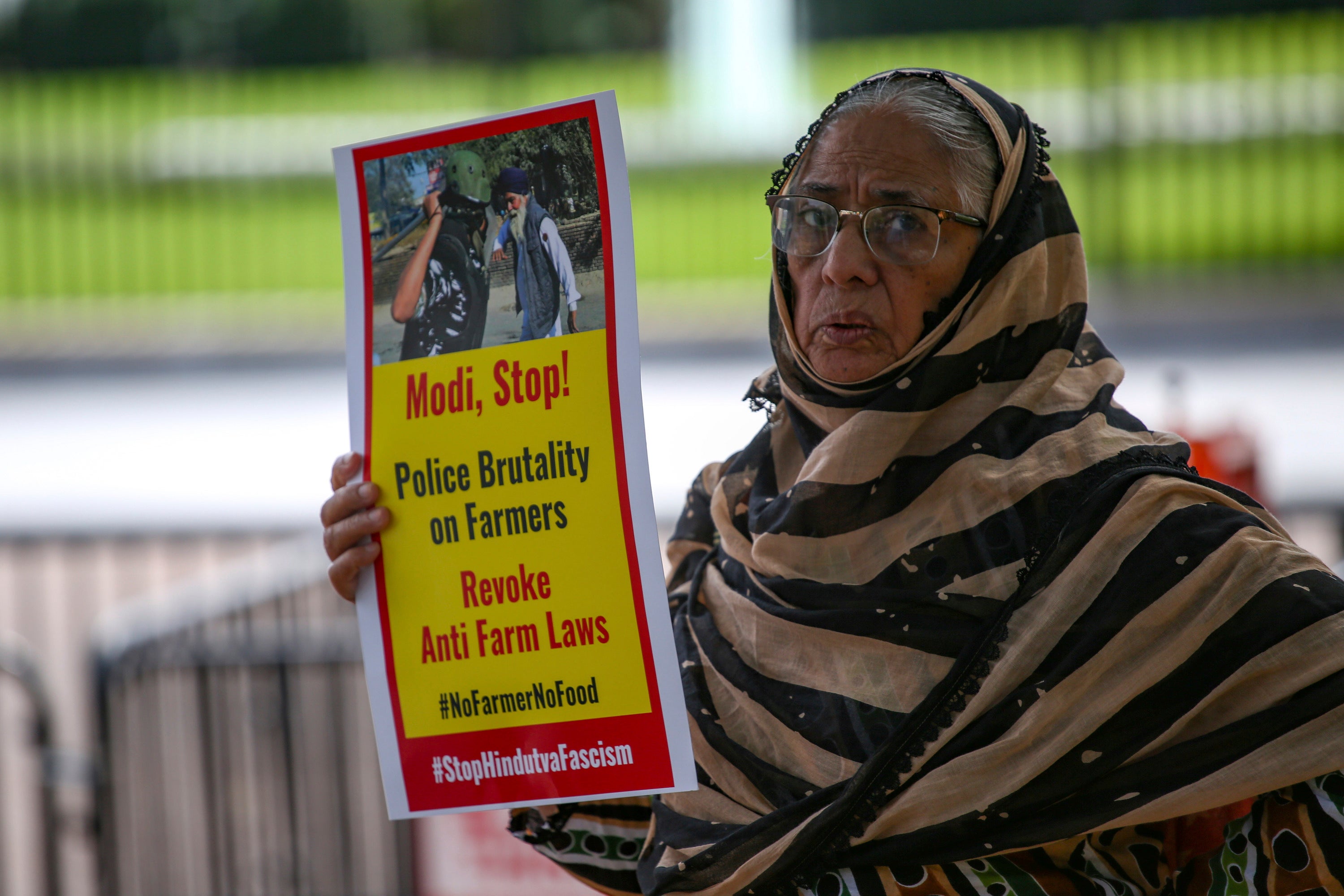 A demonstrator outside the White House in Washington, DC, protests Indian Prime Minister Narendra Modi during his visit to the United States, September 23, 2021.