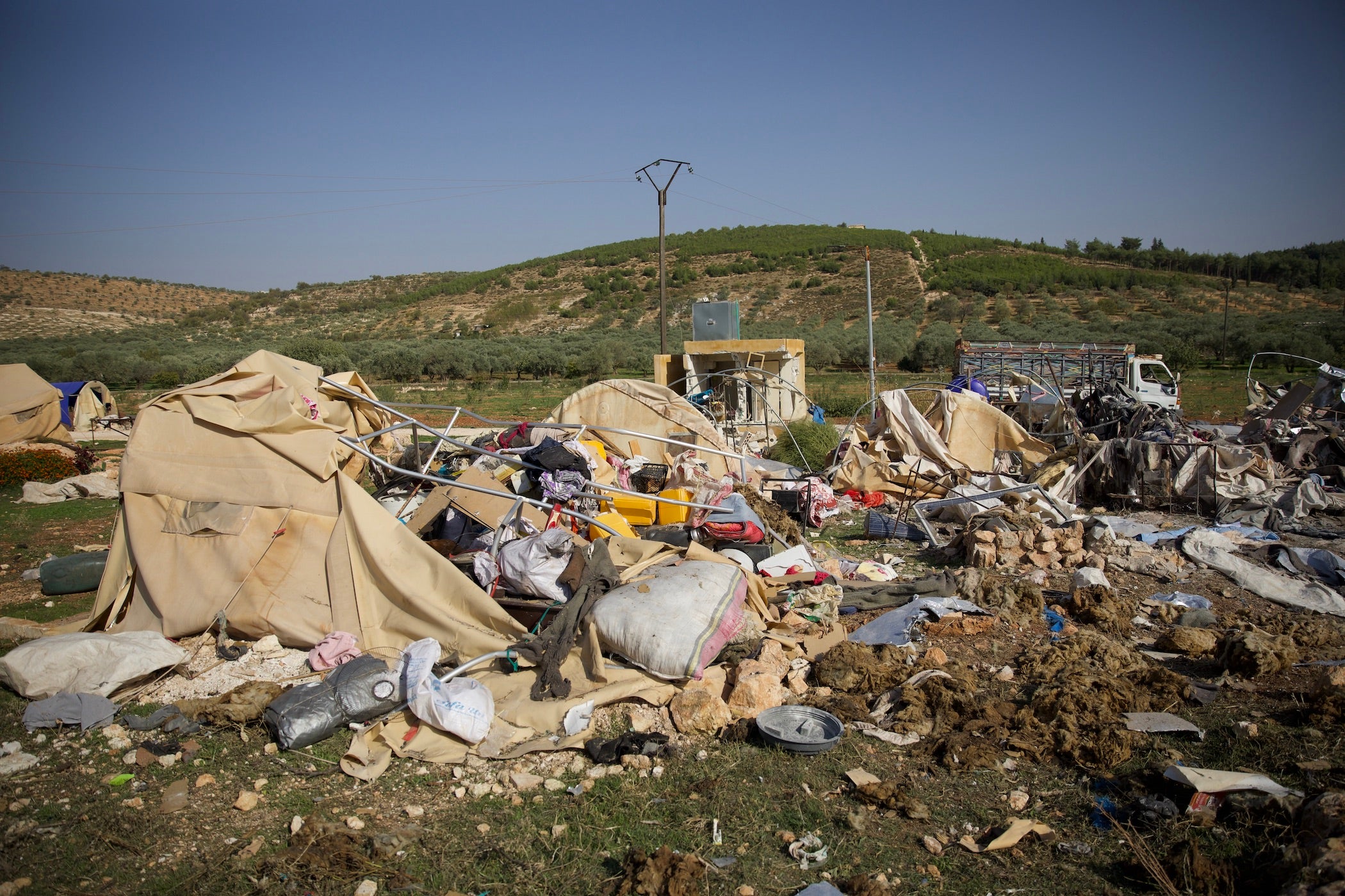 Devastation at a camp for the displaced near the town of Al-Hamamah in Idlib's western countryside following a Syrian-Russian military alliance airstrike that struck the camp on October 24, 2023, killing five members of the same family, including a pregnant woman, two infants, and their 70-year-old grandmother.