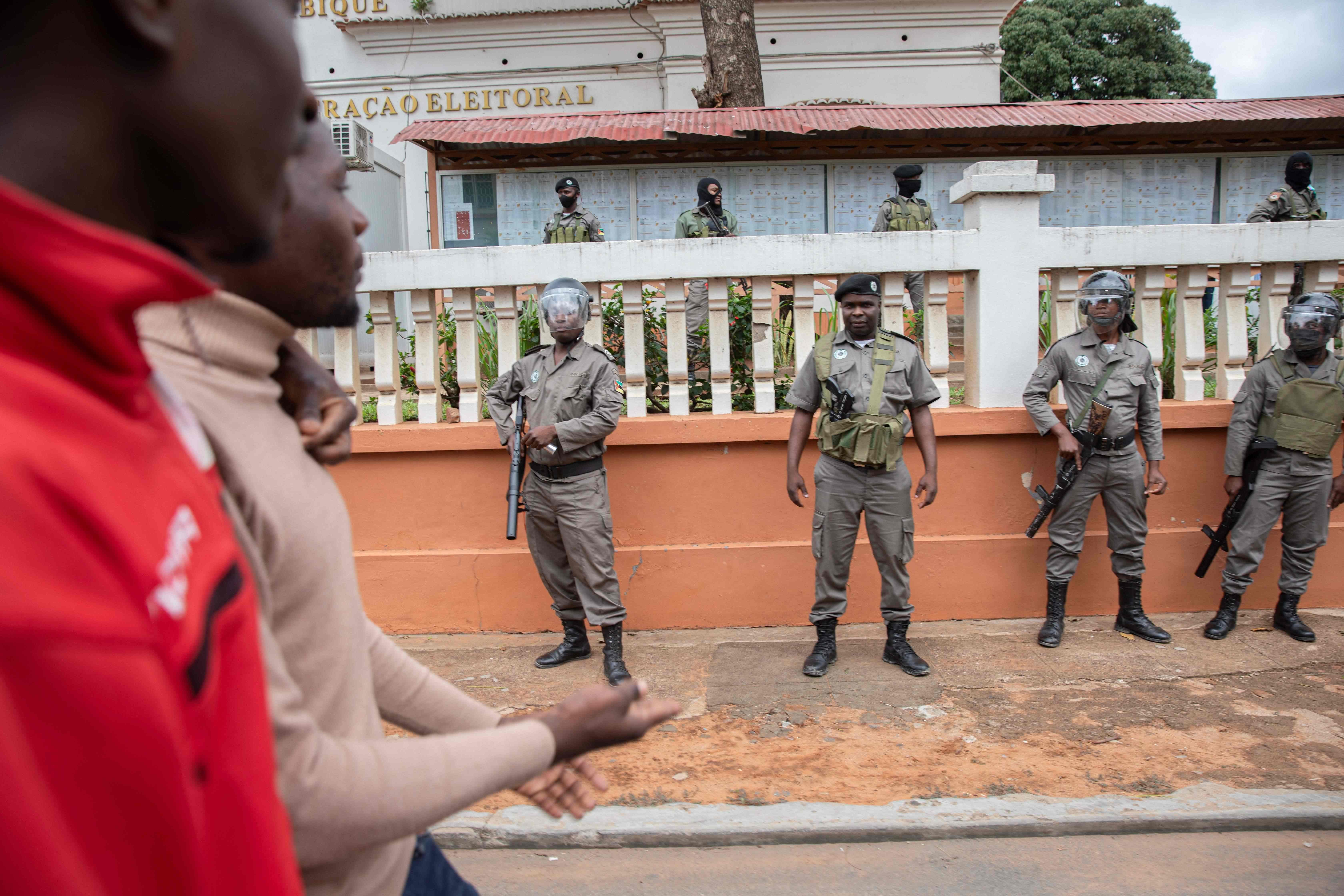 Mozambique police forces are stationed outside the Technical Secretariat of Electoral Administration building as supporters of the Mozambican opposition party Mozambican National Resistance (RENAMO) demonstrate in Maputo on October 17, 2023.