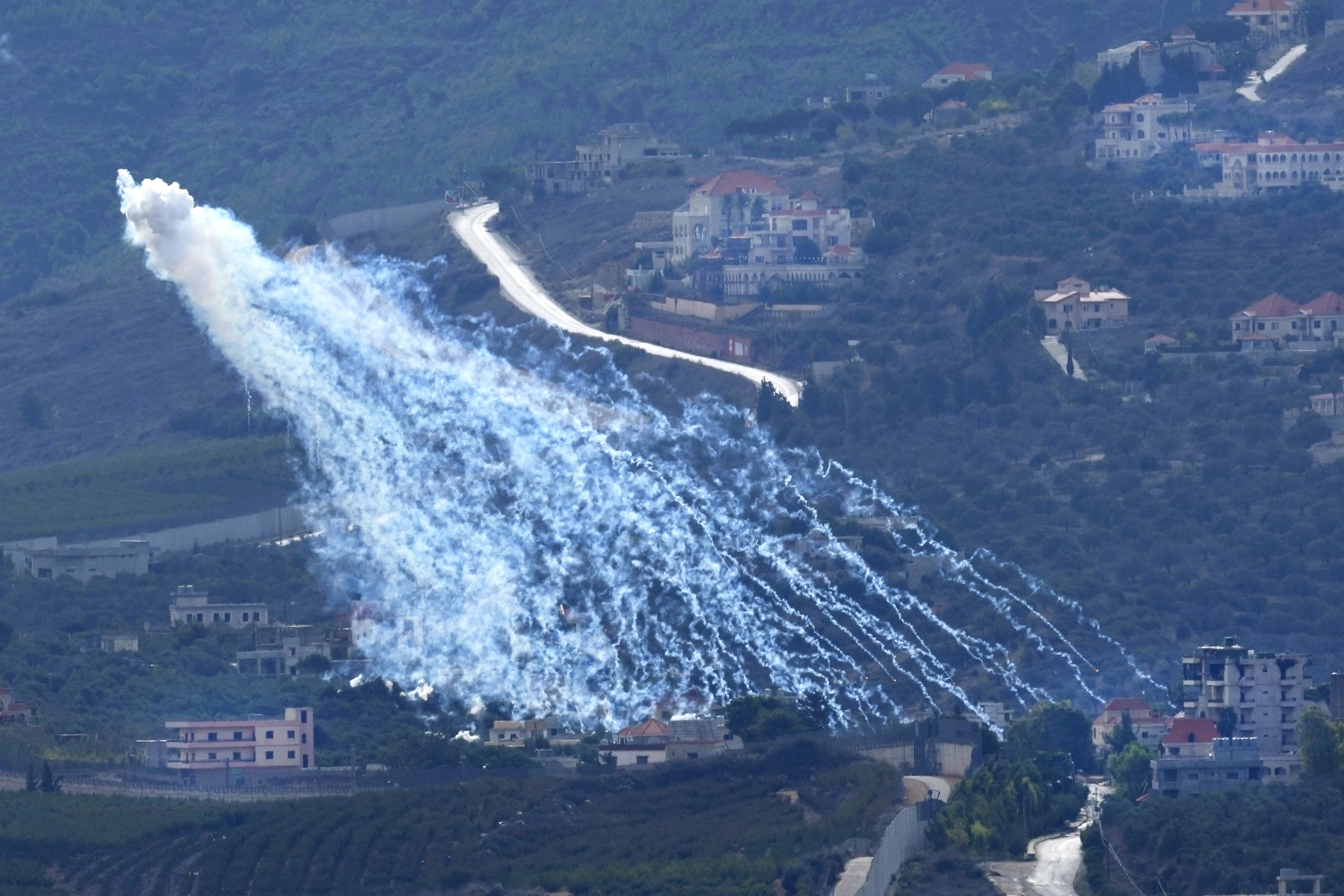 Artillery-delivered white phosphorus munition being airburst over Kfar Kila, a Lebanese border village with Israel, as seen from Marjayoun in southern Lebanon, November 22, 2023.