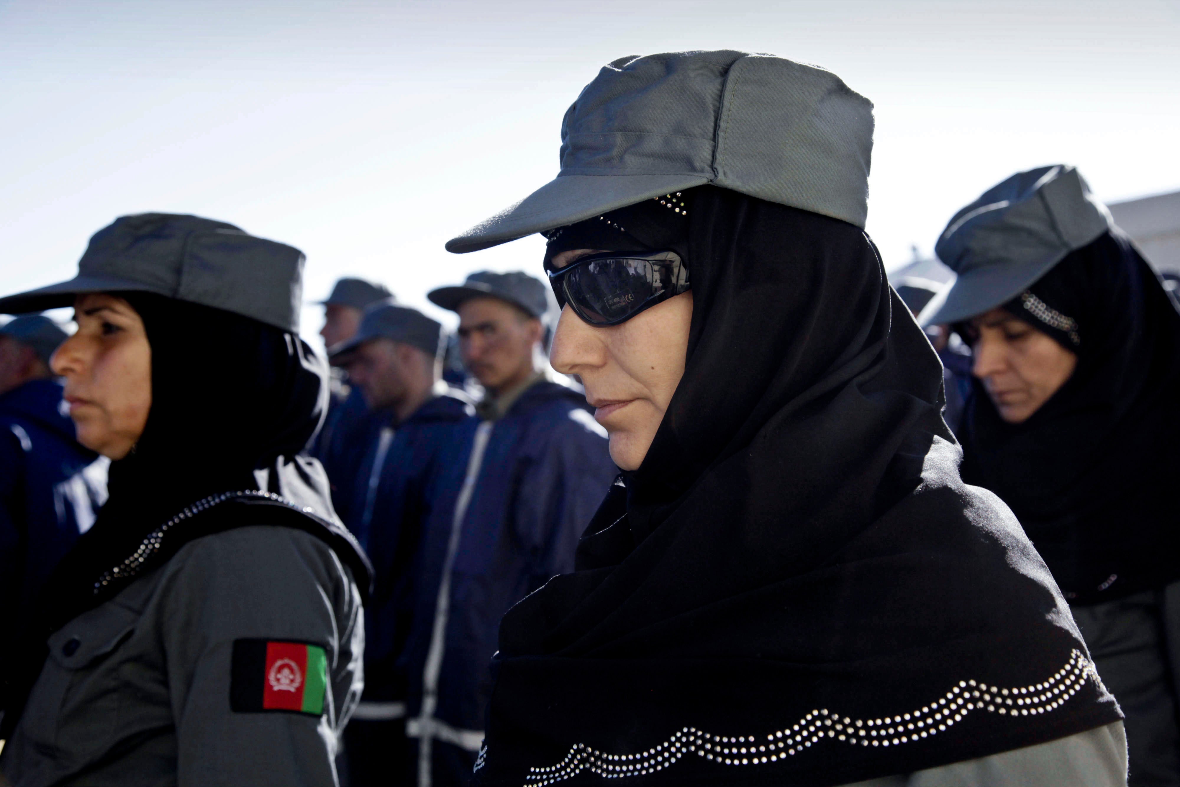 Afghan policewomen and policemen during their graduation ceremony