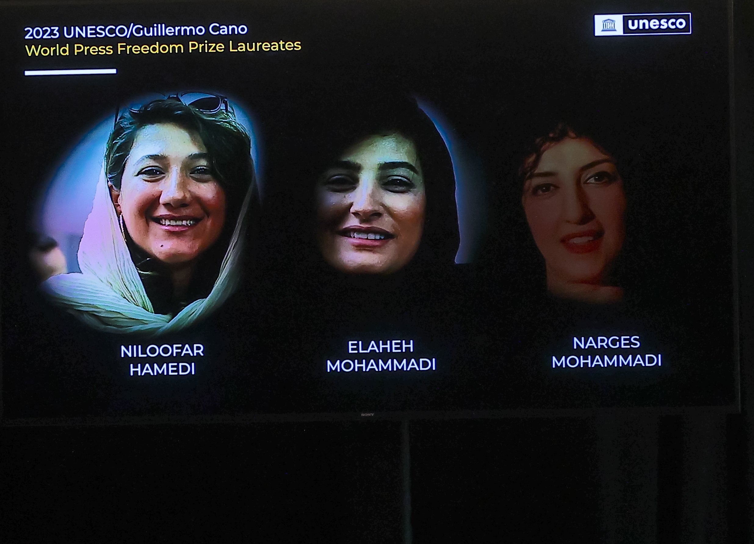 Three imprisoned Iranian female journalists, Niloofar Hamedi (L), Elaheh Mohammadi (C) and Narges Mohammadi during the award ceremony of the UNESCO/Guillermo Cano World Press Freedom Prize.
