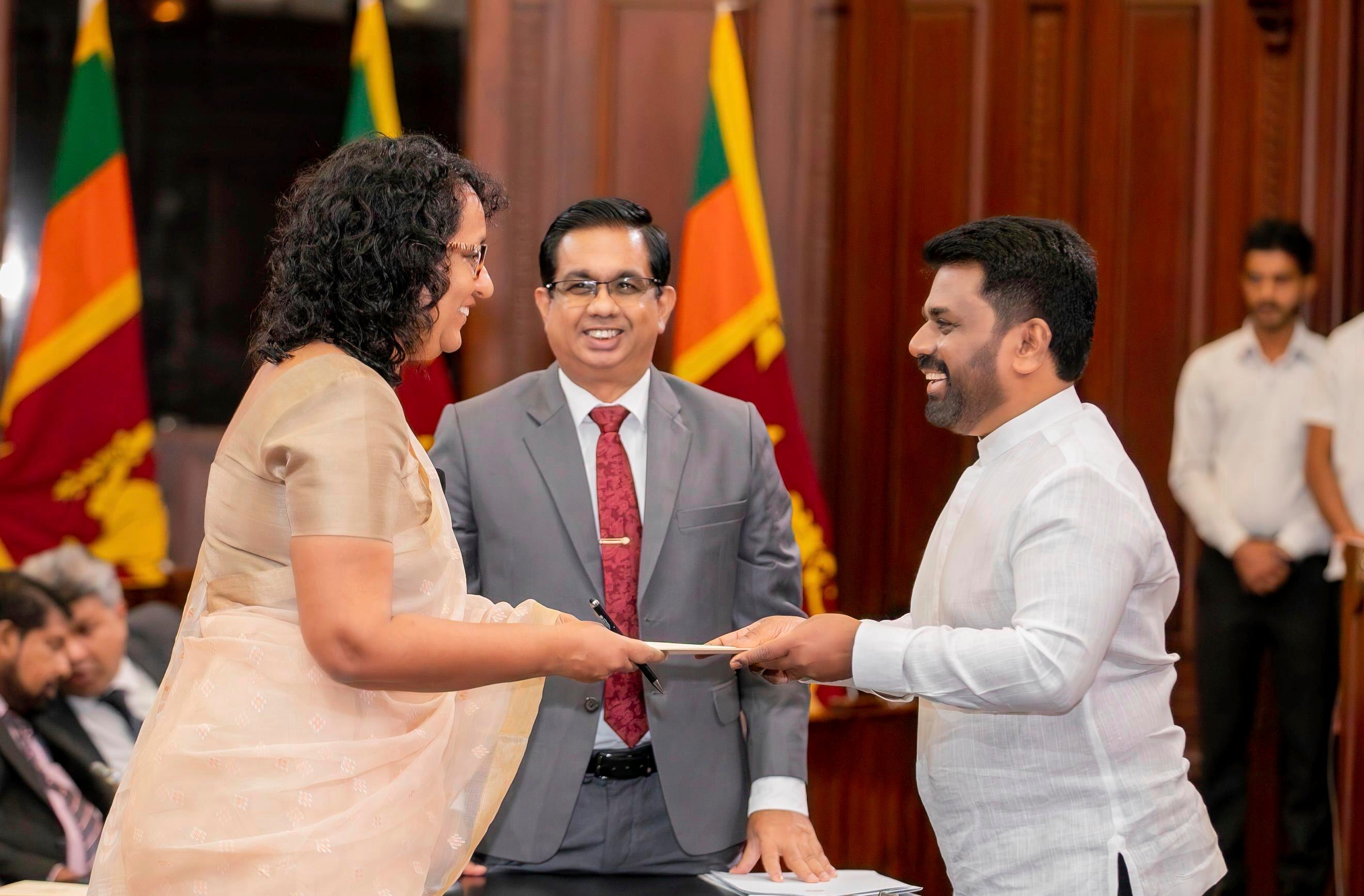 Sri Lankan President Anura Kumara Dissanayake (right) and Prime Minister Harini Amarasuriya during the swearing-in of the new cabinet members on November 18, 2024, in Colombo, Sri Lanka.