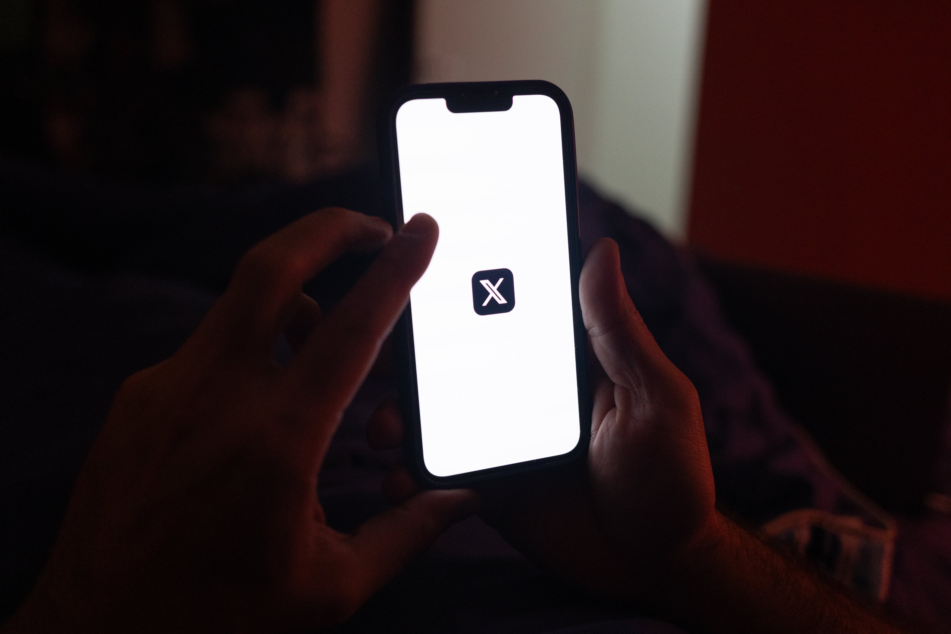 The logo of X, the social media platform formerly known as Twitter, displayed on a smartphone in Sao Paulo, Brazil, August 31, 2024.