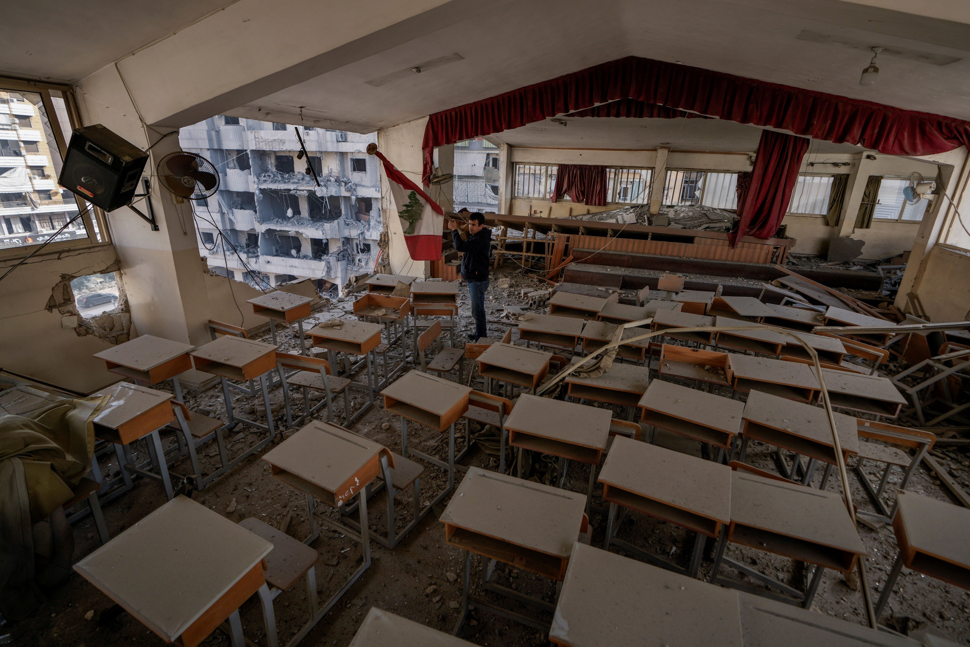 Teacher Ahmed Awada inspects his school that was damaged by an Israeli airstrike in Dahiyeh, Beirut, Lebanon, November 29, 2024