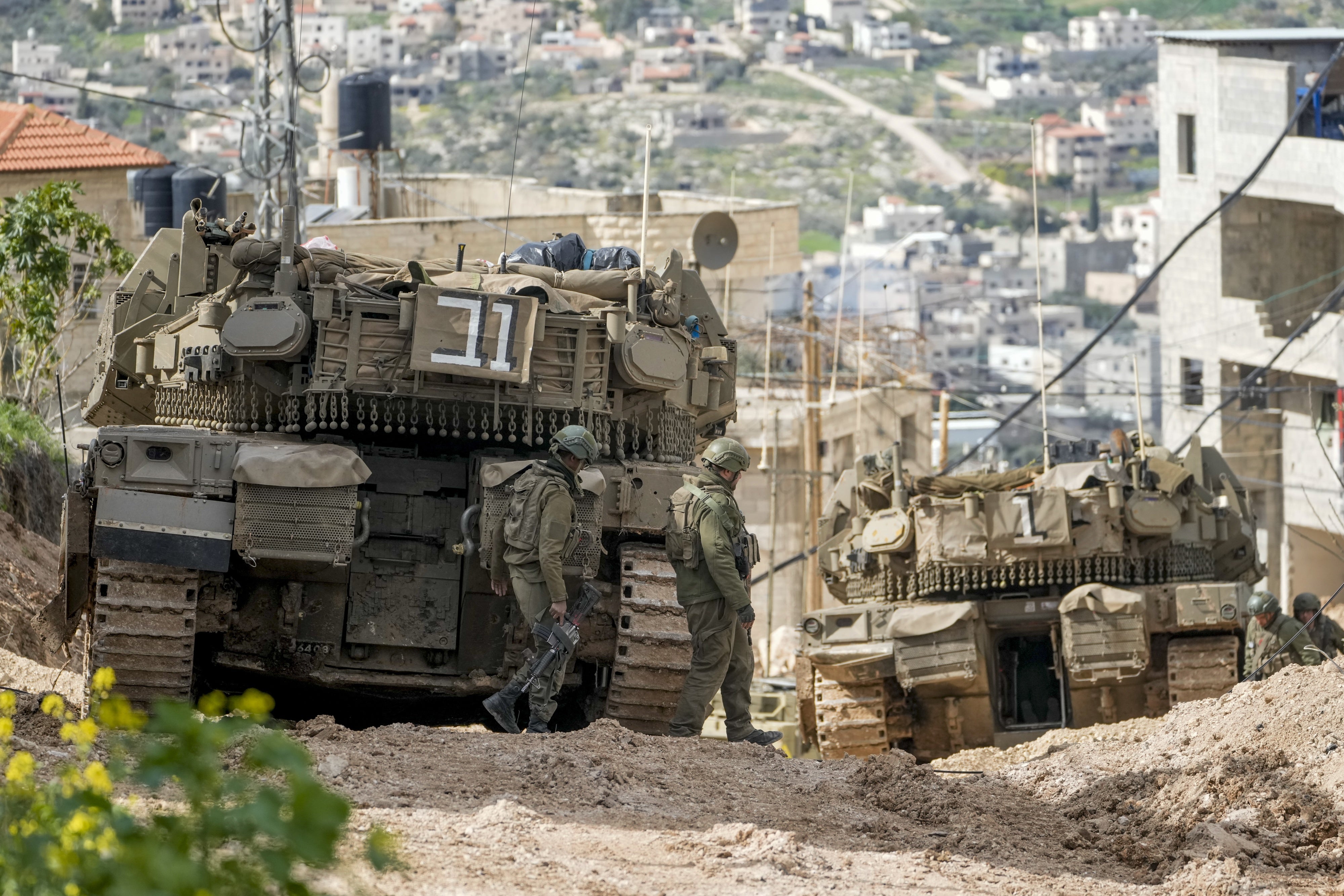 Israeli tanks are deployed during an ongoing army operation in the Jenin refugee camp in the occupied West Bank, February 24, 2025.