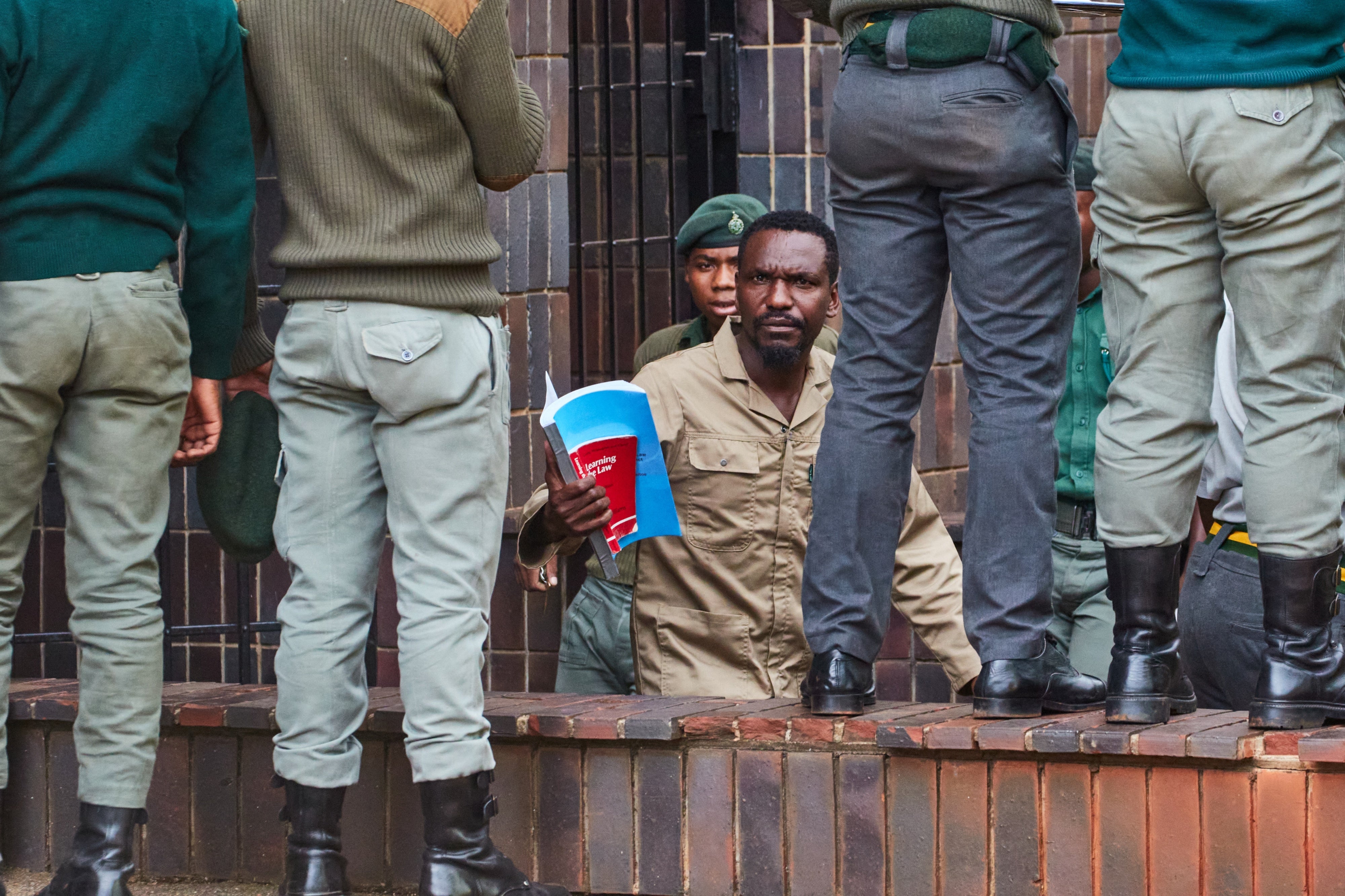 Blessed Mhlanga walking in Harare.