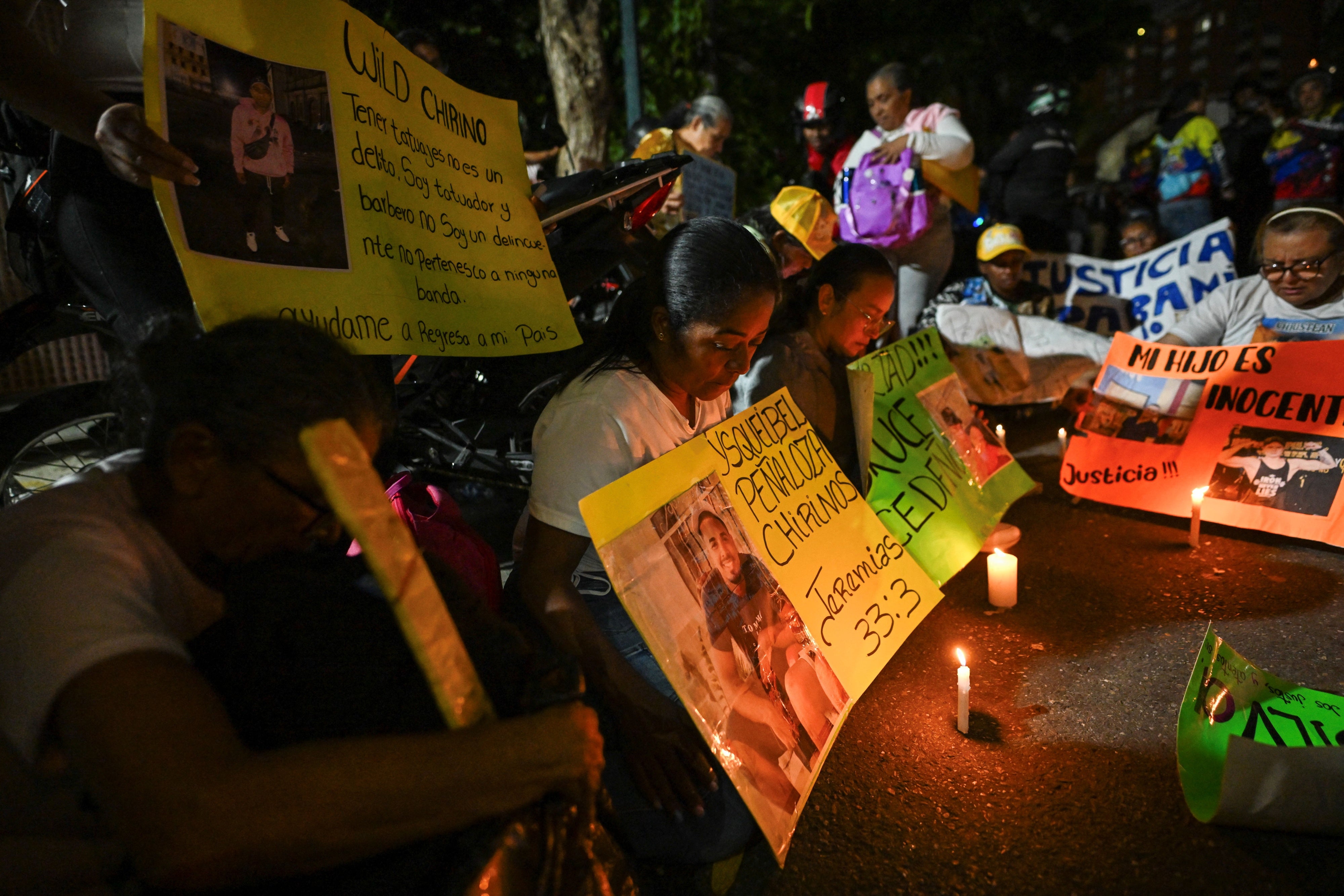 Relatives of Venezuelan migrants deported from the US to a maximum security prison in El Salvador attend a vigil in front of the El Salvadoran embassy in Caracas on April 2, 2025. 