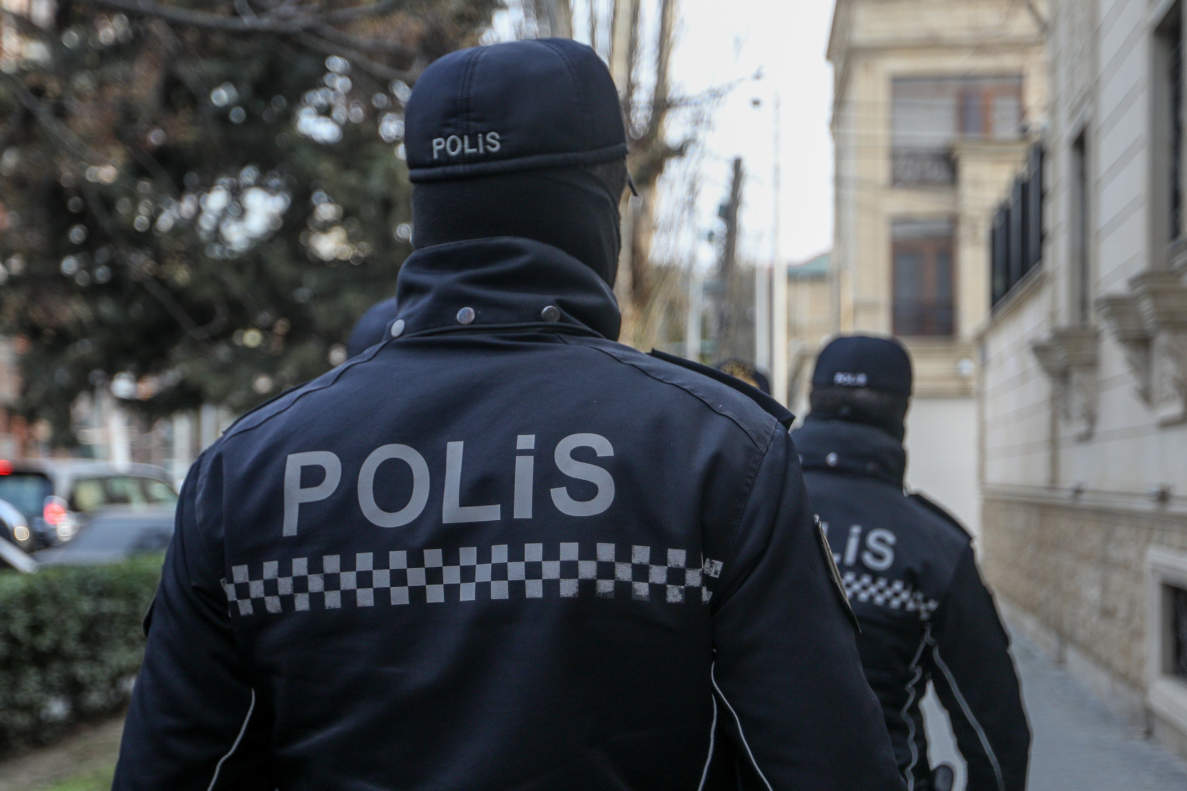 Police outside the building of Toplum TV, independent online media outlet, where law enforcement searched the offices and detained journalists, in Baku, Azerbaijan, March 6, 2024.