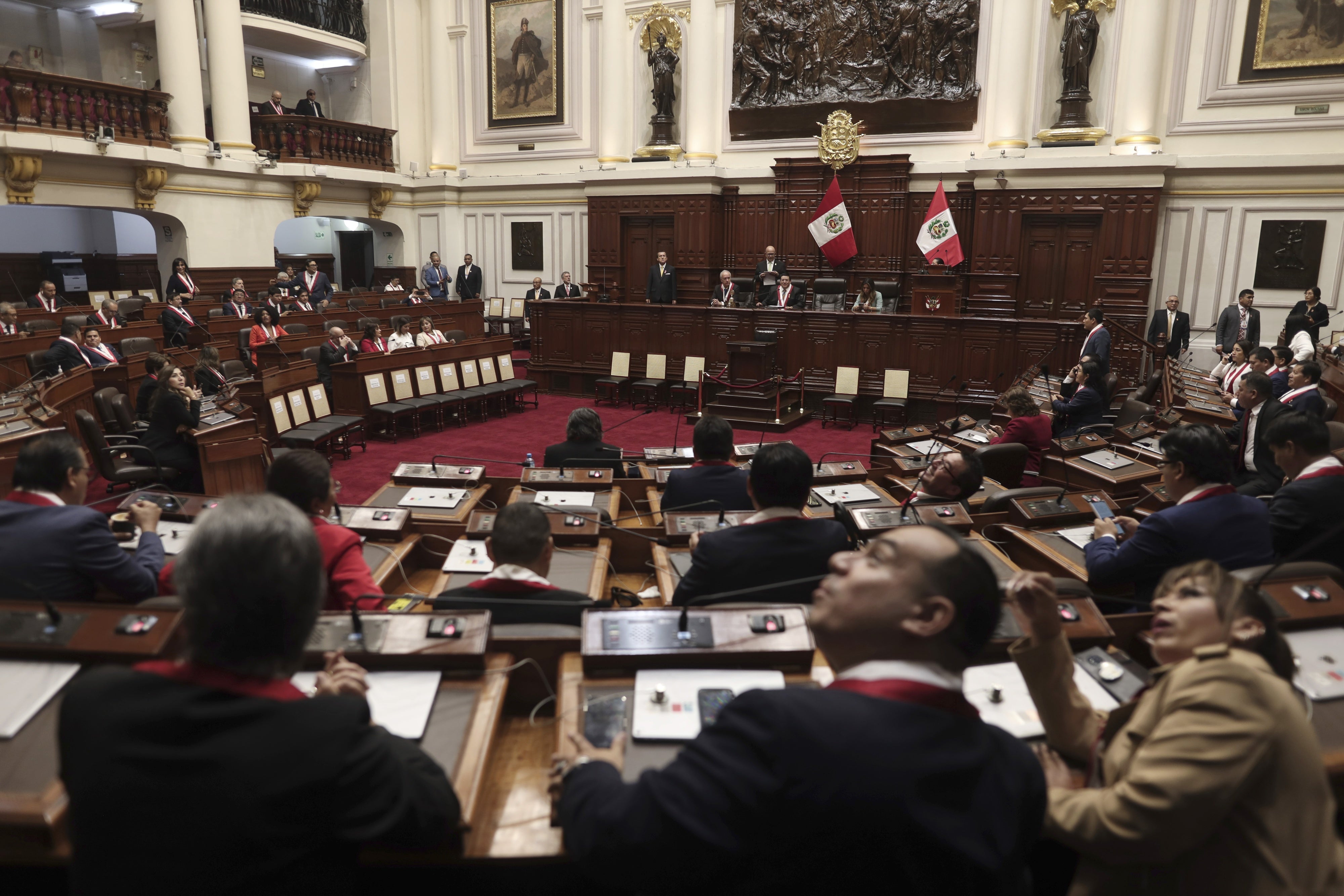 Lawmakers sit inside Congress as they wait for the arrival of Peruvian President Dina Boluarte, in Lima, Peru, July 28, 2023. 