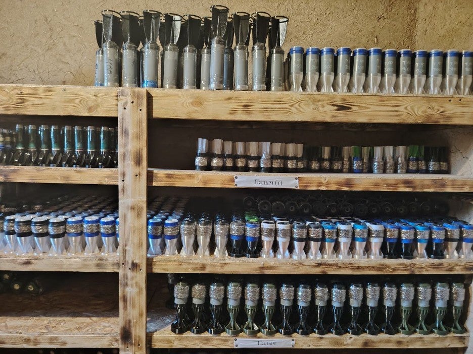 Rows of shelves filled with drone-dropped munitions