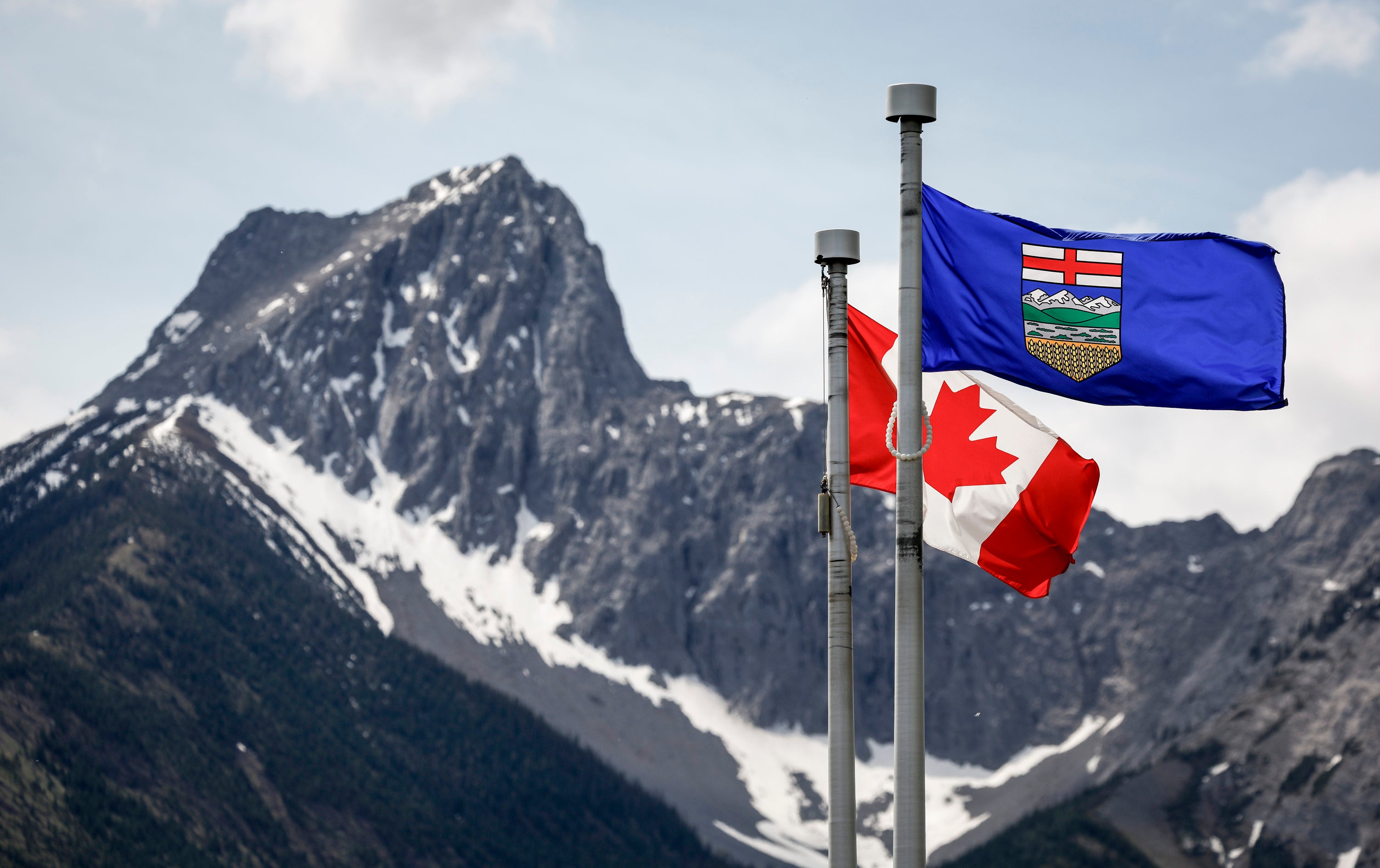 A Canada flag and an Alberta flag in Kananaskis, Alberta, June 2, 2025.  