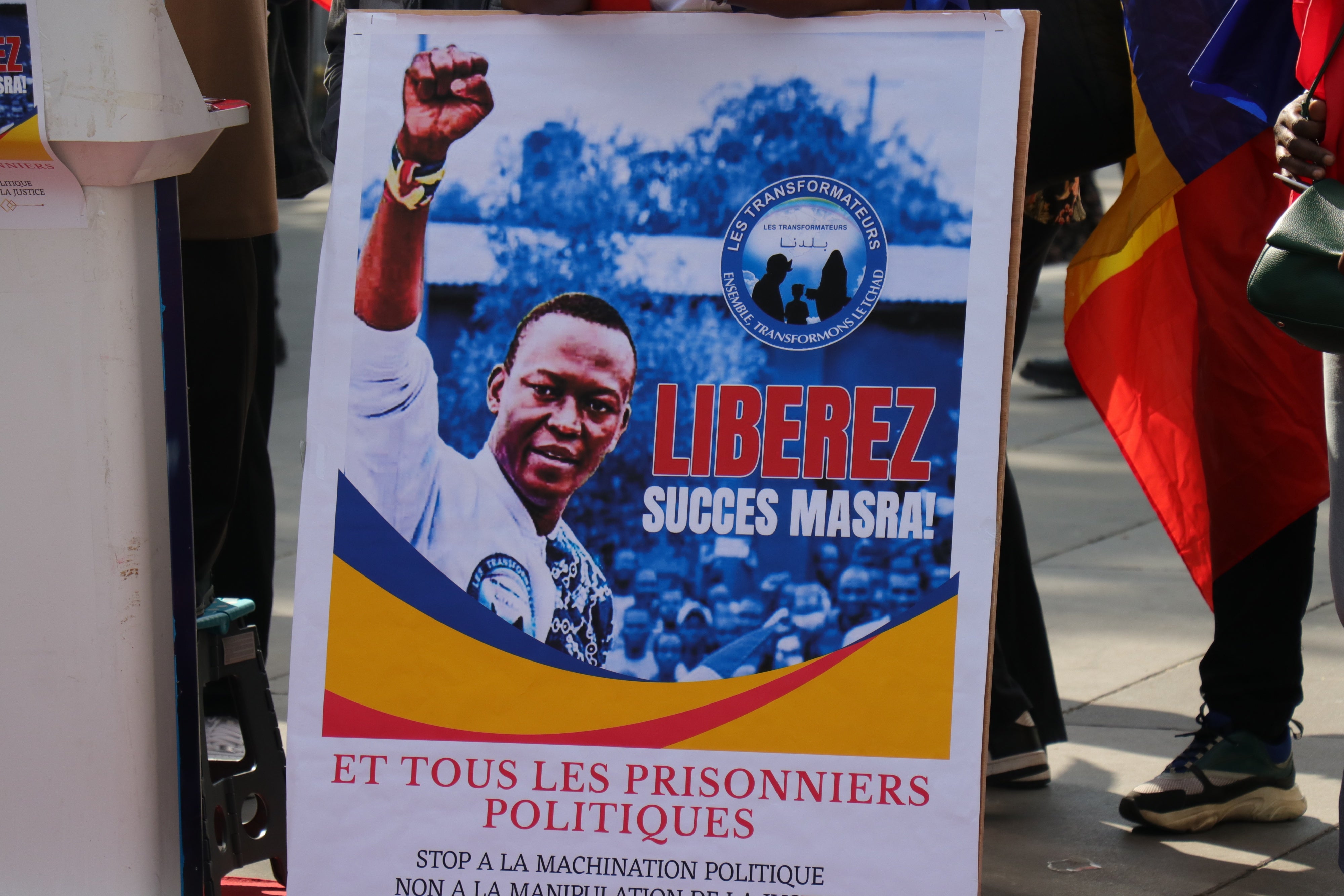 A poster calling for the release of Succes Masra at a protest in Paris.