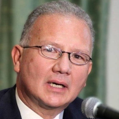 A man speaking into a microphone