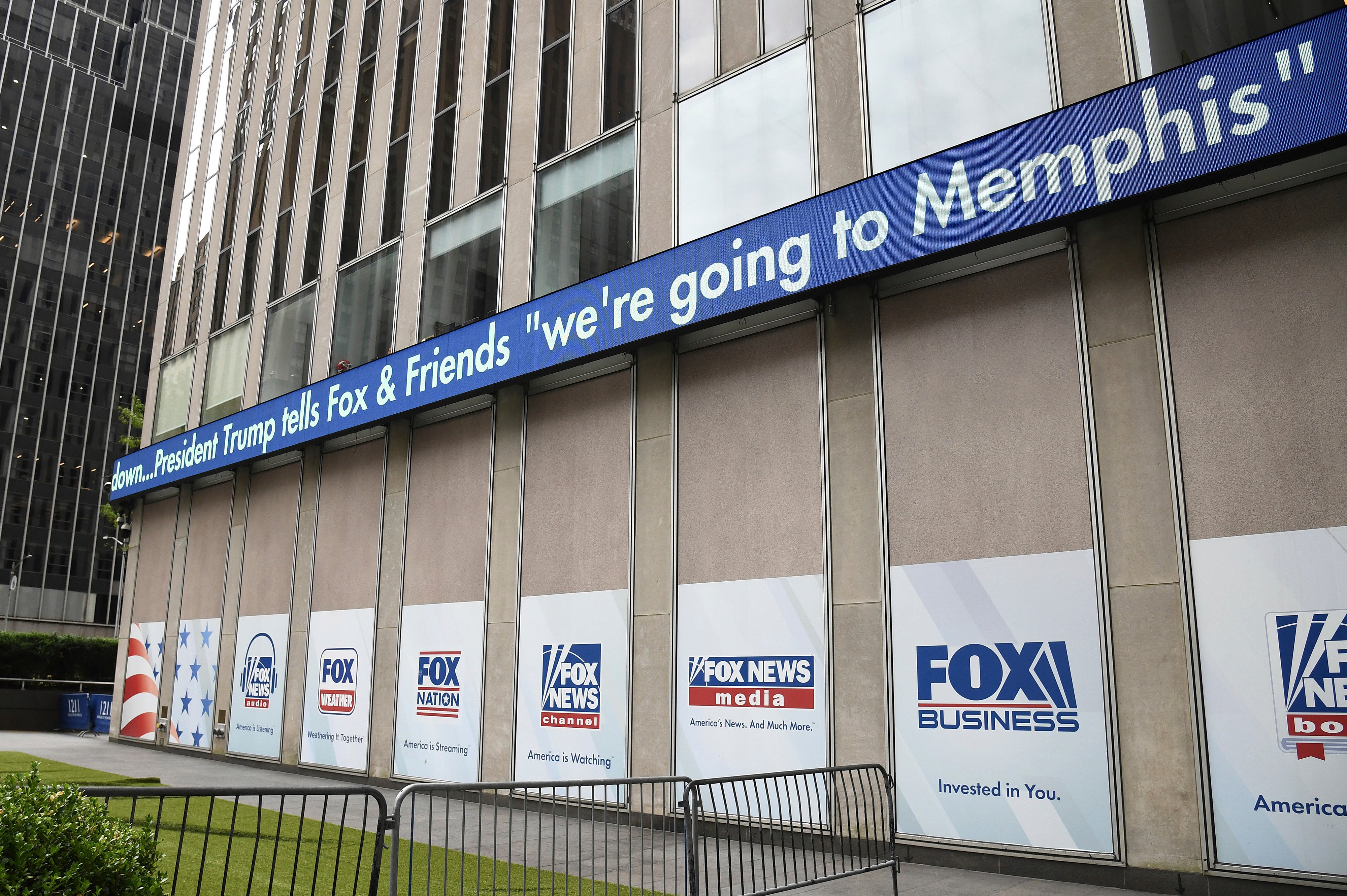 A news ticker announcing a plan to deploy the National Guard