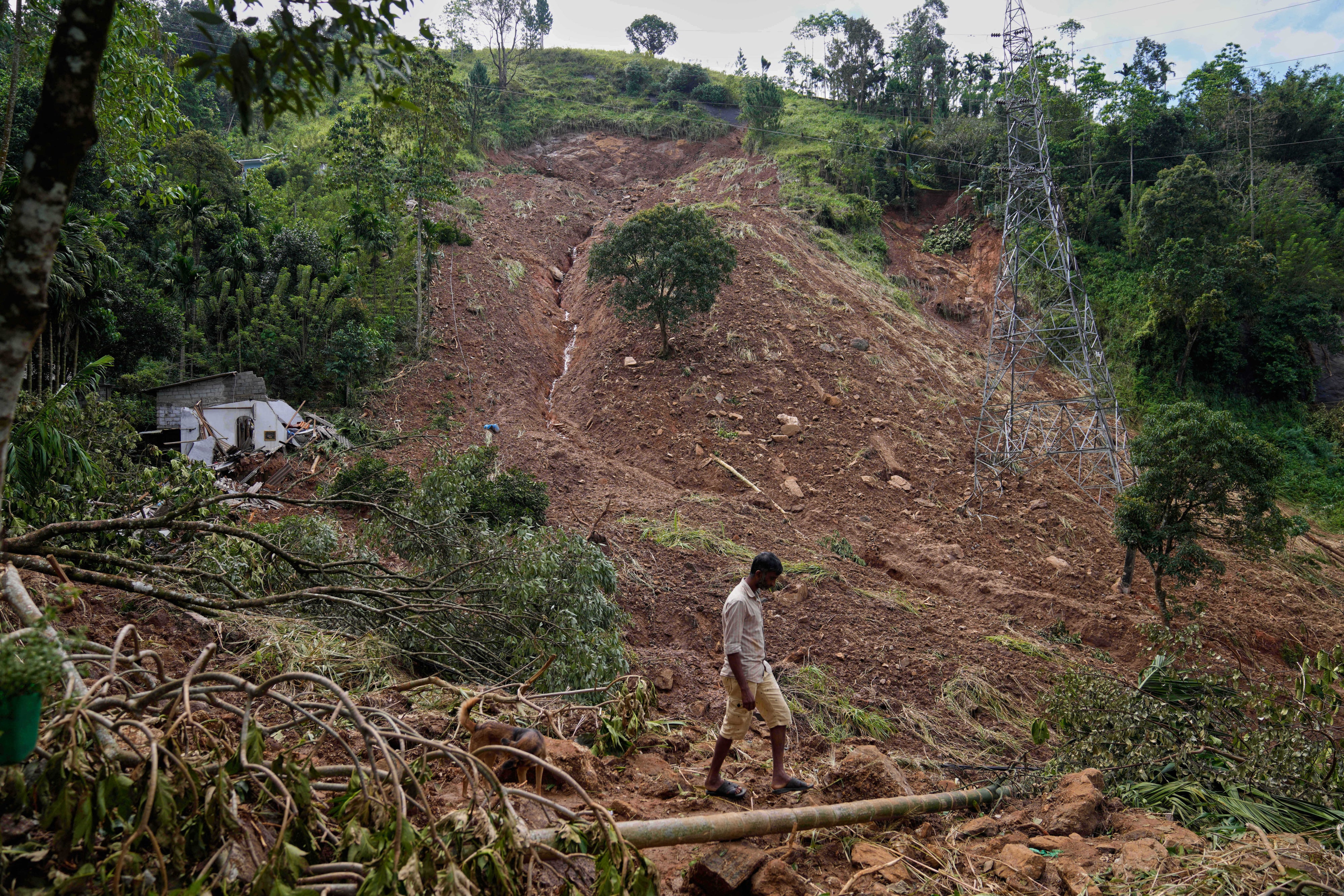 A landslide survivor searches for his belongings following Cyclone Ditwah in Kandy, Sri Lanka, December 1, 2025.