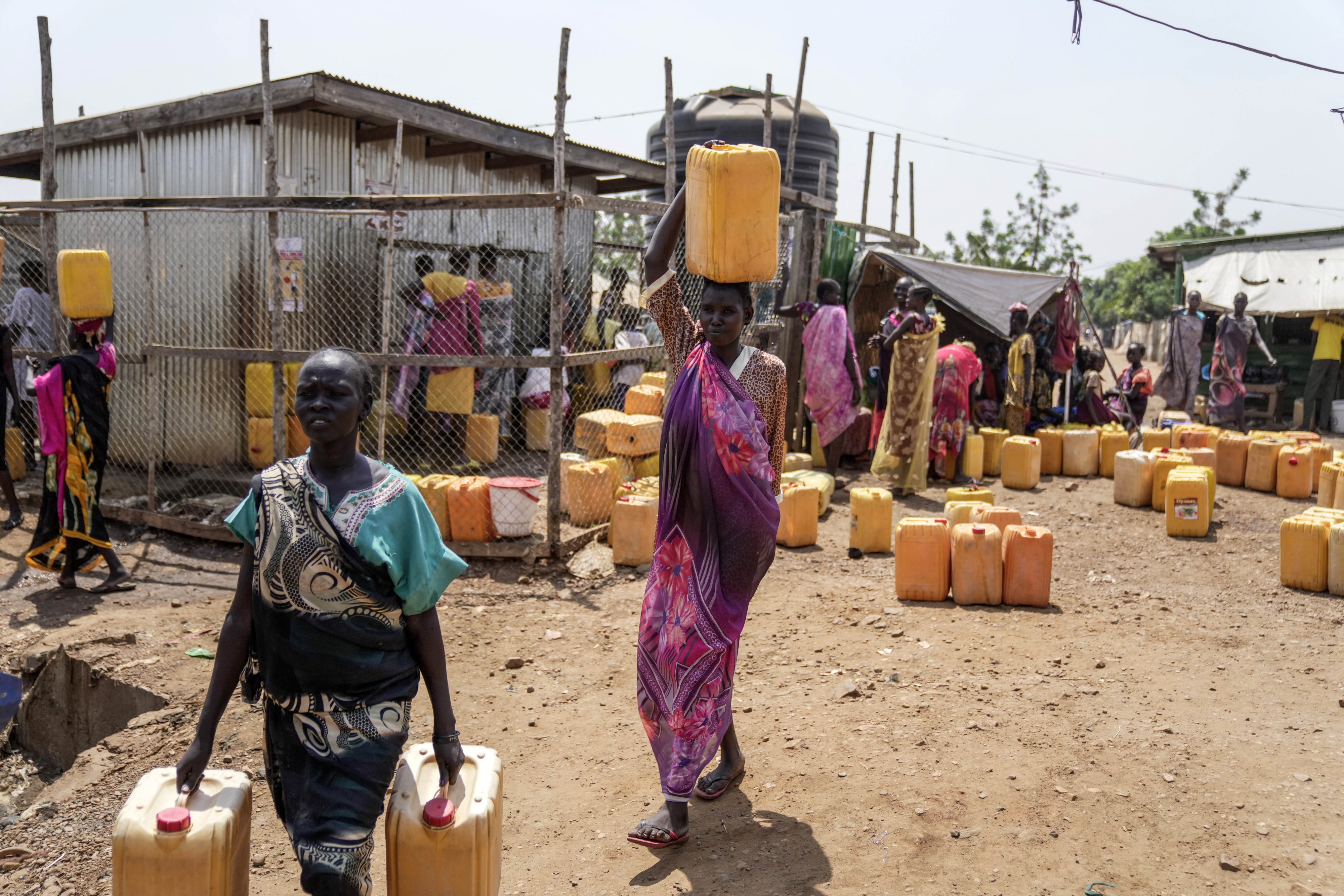 Internally displaced people fetch water inside a camp in the outskirts of Juba, South Sudan, February 13, 2025.