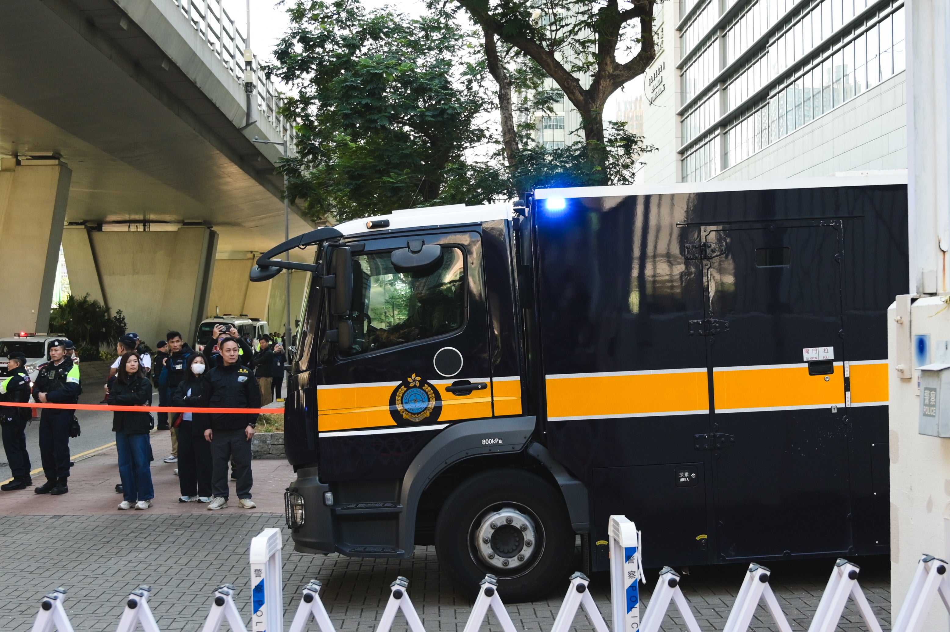 Prisoner transport vehicles outside the court in Hong Kong