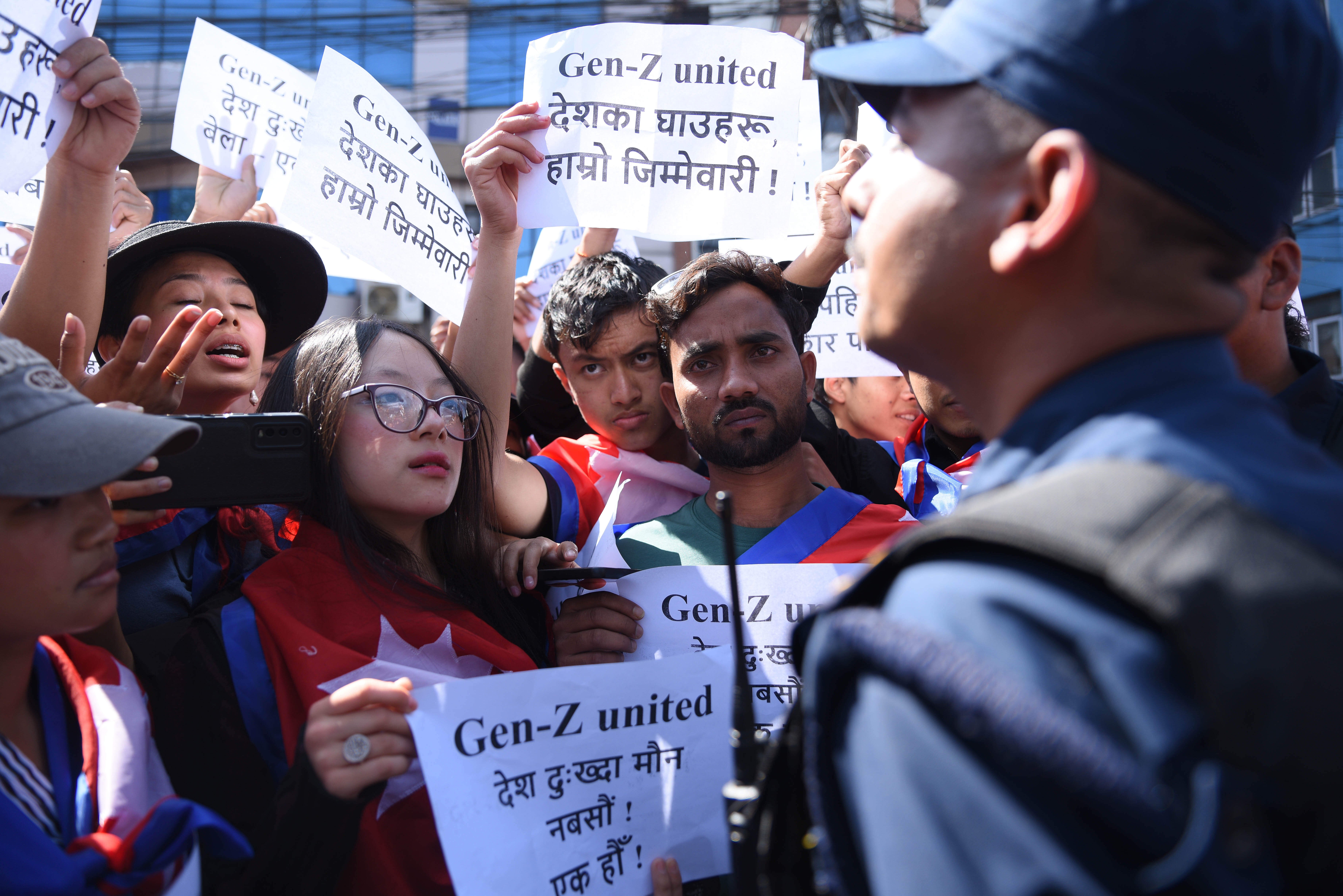 Nepali Gen Z activists hold banners which read "Don't Forget the Blood of Martyrs"