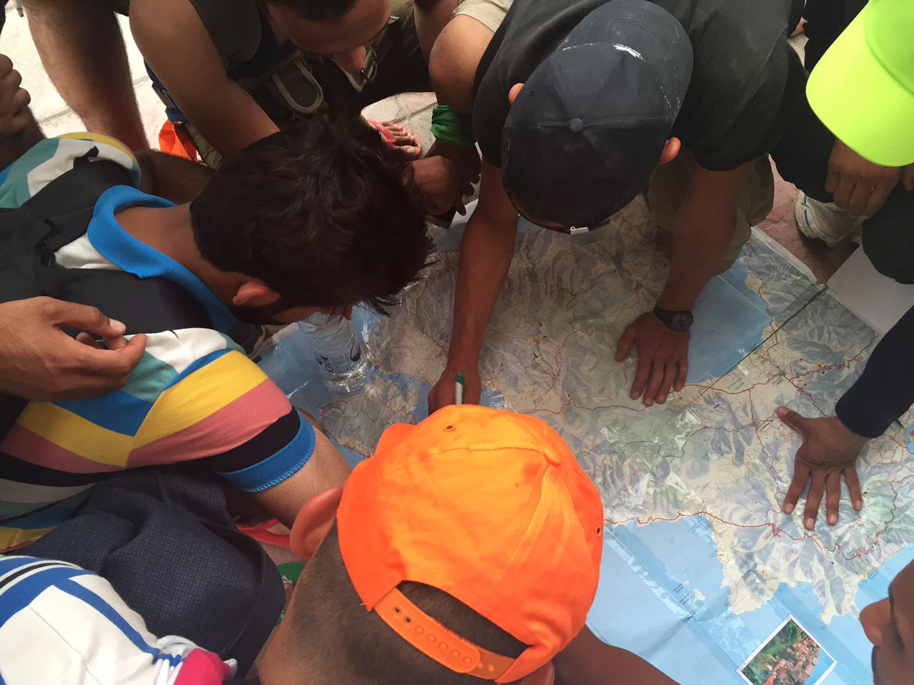 Syrian asylum seekers on the Greek island of Lesbos study the route they will walk to reach Mytilene, the island’s capital.