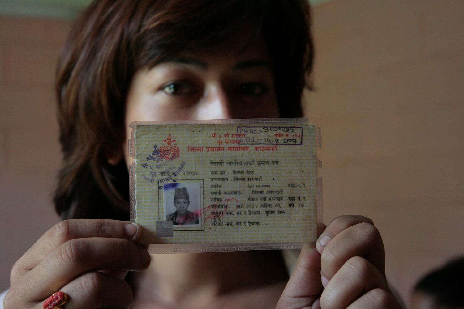Bhumika Shrestha, a transgender woman in Nepal, holds her citizenship certificate, which listed her as male in 2011. Nepal legally recognized a third gender category beginning in 2007, but it took Shrestha and other activists and transgender citizens unti