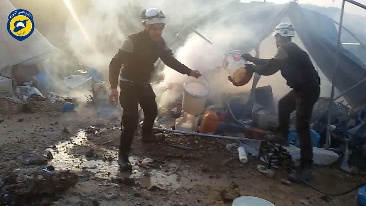 Local Civil Defence Forces extinguishing flames in tent after Syrian government forces shelling hit Khirmash displaced persons camp in Syria on Turkey’s border on April 14, 2016. 