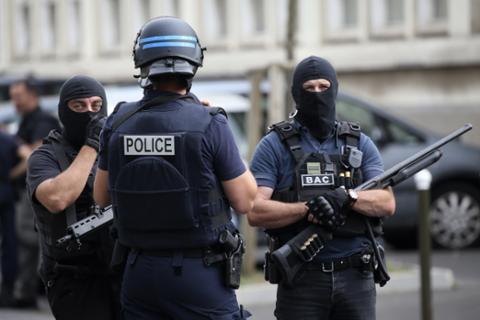 French police and an anti-crime brigade secure a street during a counterterrorism operation in the Paris suburb of Argenteuil on July 21, 2016, the day Parliament extended France’s state of emergency.