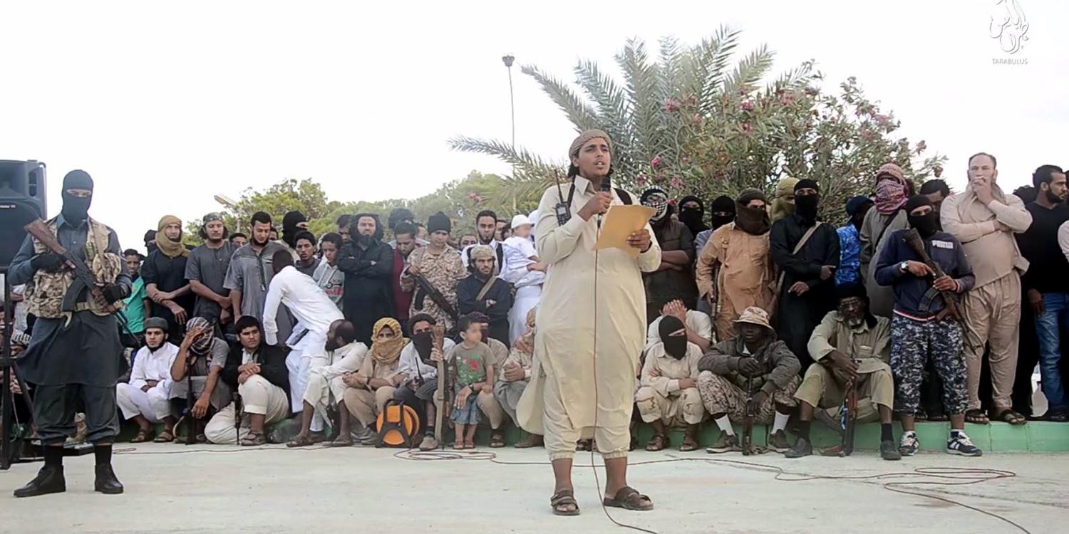 An ISIS official makes an announcement ahead of the execution of two men for “sorcery” in Sirte, Libya. Image from a 2015 Islamic State (ISIS) video. The online clearinghouse Jihadology.net posted the video on its website.