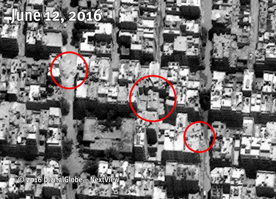 Satellite image reveals extensive building destruction in Al-Qatirji neighborhood, Aleppo, after multiple air strikes on June 5, 2016. Distinct impact locations indicated with red circles. 