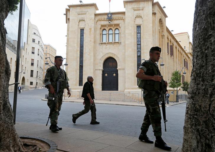 Lebanese army soldiers secure the area outside the parliament building in downtown Beirut, Lebanon. 