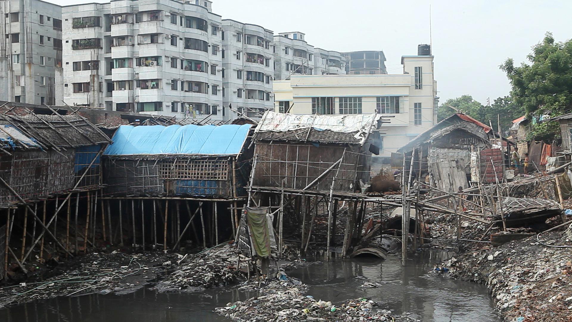 Slum houses in Hazaribagh beside an open gutter channeling untreated effluent from tanneries nearby. Local residents of Hazaribagh reported to Human Rights Watch an array of health problems—many of them undiagnosed due to the cost of medical attention—suc