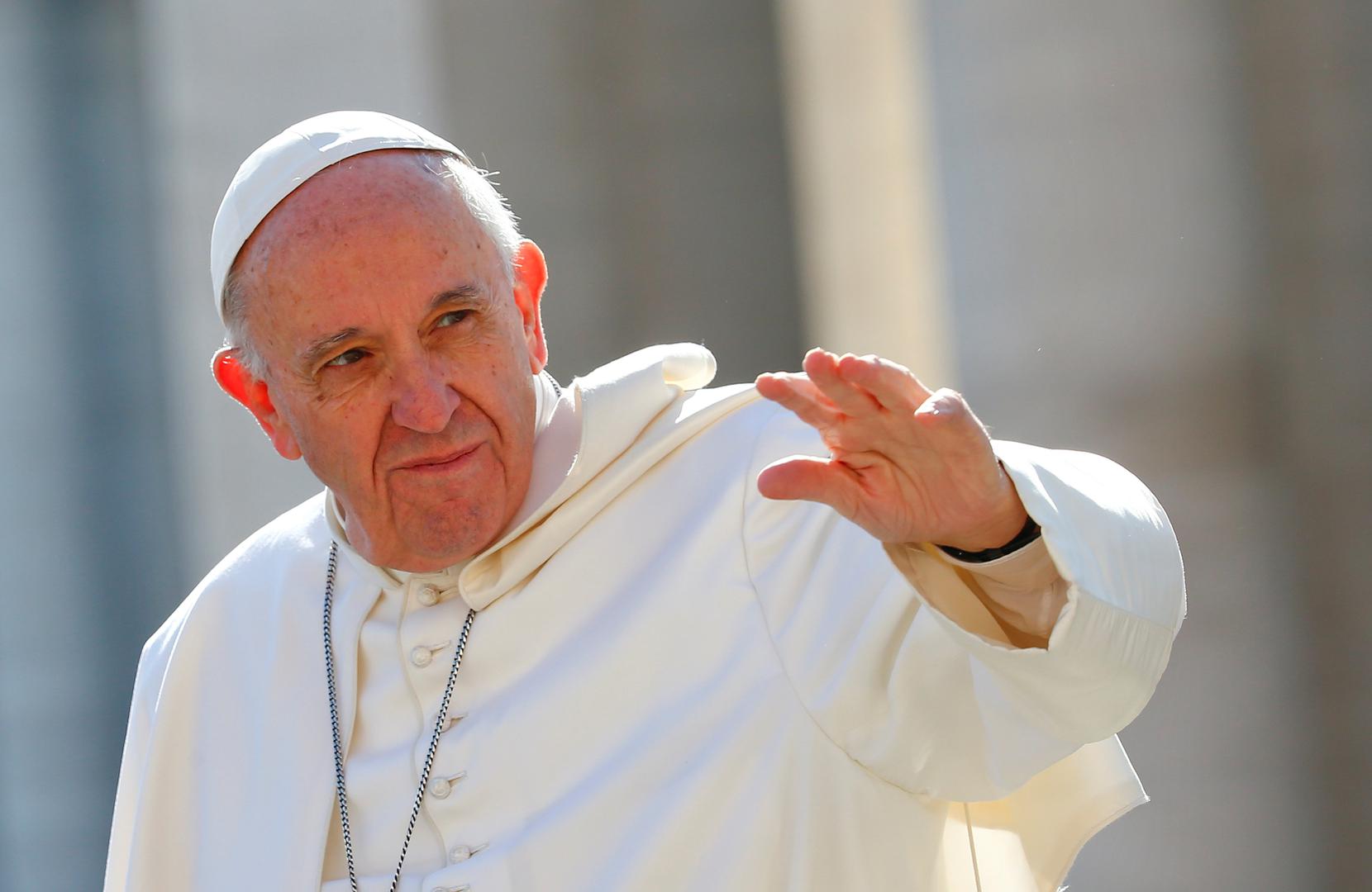 Pope Francis waves as he arrives to lead his Wednesday general audience in Saint Peter's square at the Vatican, March 15, 2017. 