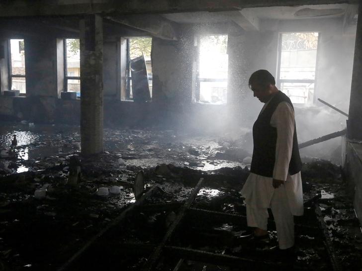 A man inspects a Shia mosque after an attack claimed by the Afghan affiliate of the Islamic State in Kabul, Afghanistan, August 25, 2017. 