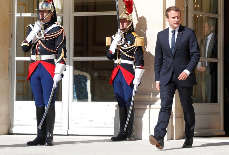 French President Emmanuel Macron waits for a guest outside the Elysee Palace in Paris, France, September 15, 2017. 