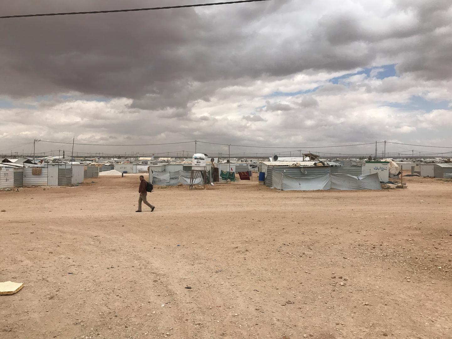 A lone man crosses Zaatari refugee camp in Jordan. The camp population fell from 203,000 during its peak in April 2013 to 80,000 by July 2017.  