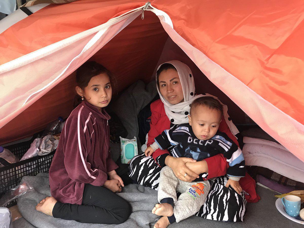 Mariam, an Afghan asylum seeker and her children in their tent in the Moria hotspot on the Greek island of Lesbos, on December 4, 2017.